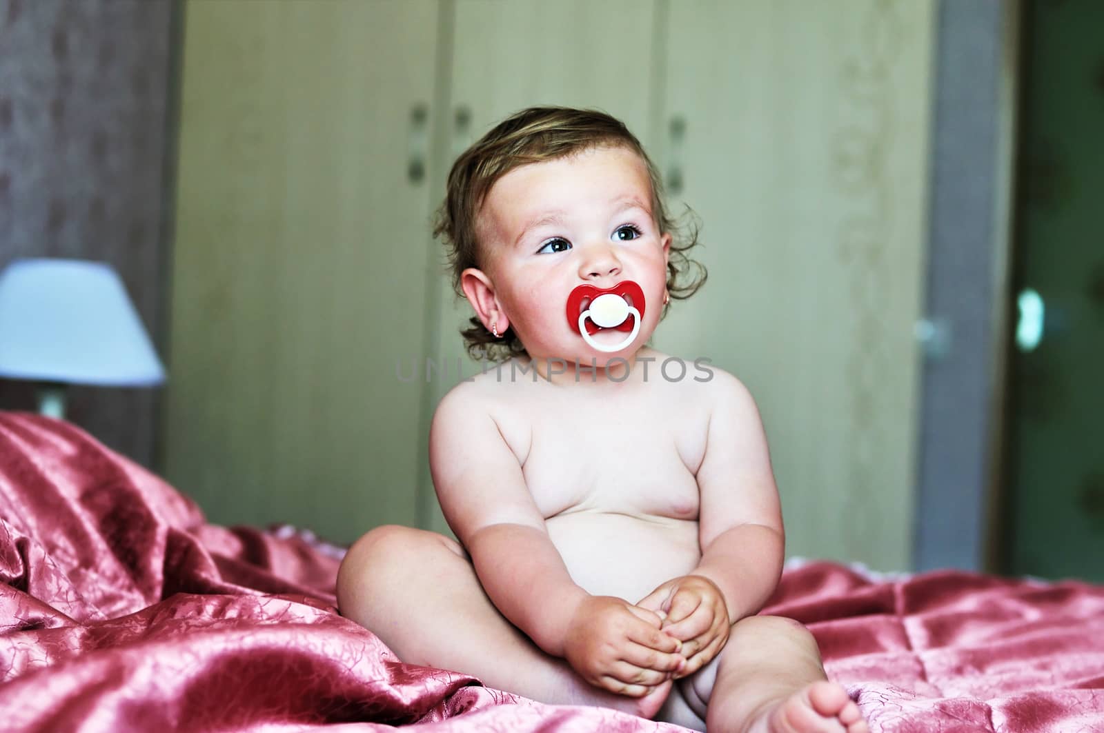 baby with soother by Reana