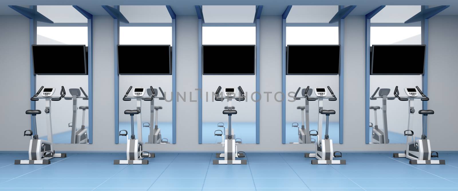Exercise bikes in a row at fitness center