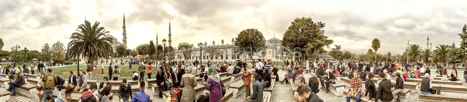 ISTANBUL - SEPTEMBER 20, 2014: Tourists take a break in Sultanahmet Square. More than 10 milltion people visit the city annually.