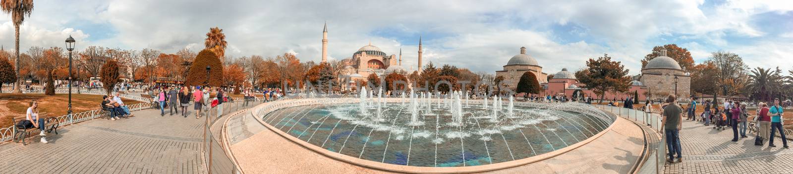 ISTANBUL - SEPTEMBER 21, 2014: Tourists enjoy city life in Sultanahmet Park. Istanbul attracts more than 10 million every year.