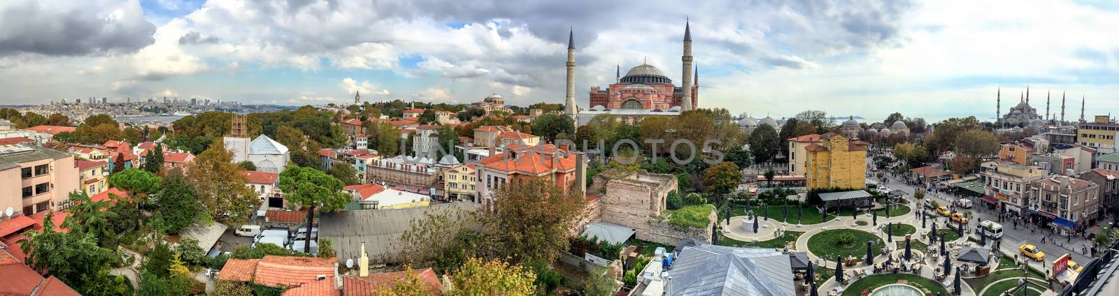 ISTANBUL - SEPTEMBER 21, 2014: Tourists enjoy city life in Sultanahmet Park. Istanbul attracts more than 10 million every year.