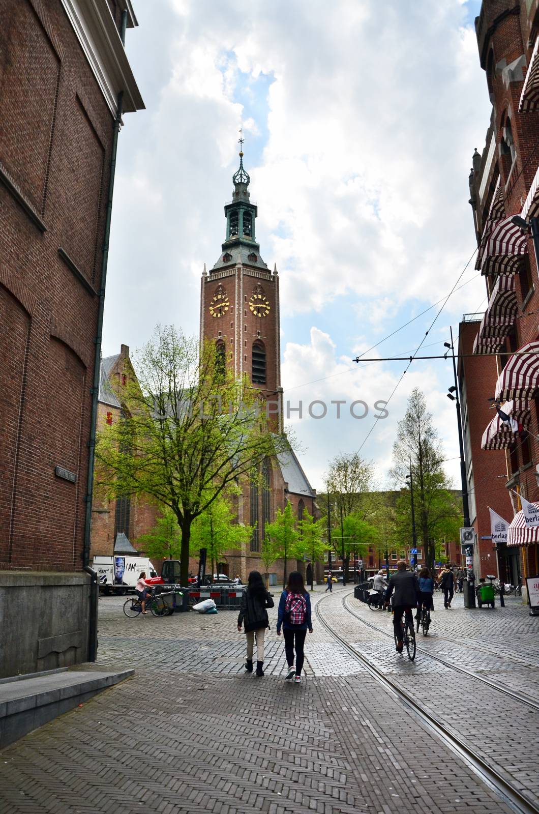 The Hague, Netherlands - May 8, 2015: People at Grote of Sint-Jacobskerk (Big Church). Grote of Sint-Jacobskerk is a landmark Protestant church in The Hague, Netherlands.