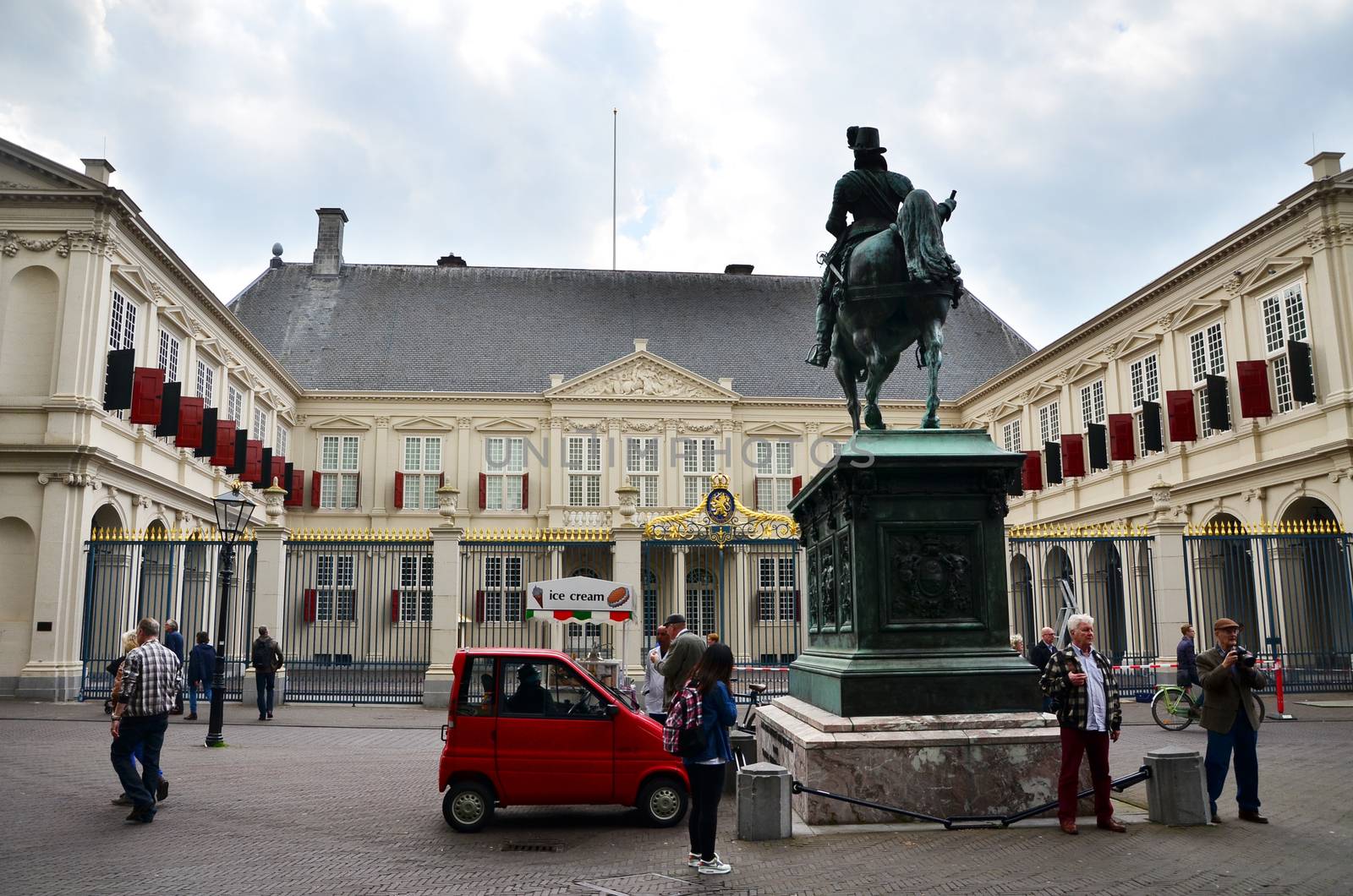 The Hague, Netherlands - May 8, 2015: People visit Noordeinde Palace, the Hague, Netherlands. Hague is the capital of the province South Netherlands.on May 8, 2015.