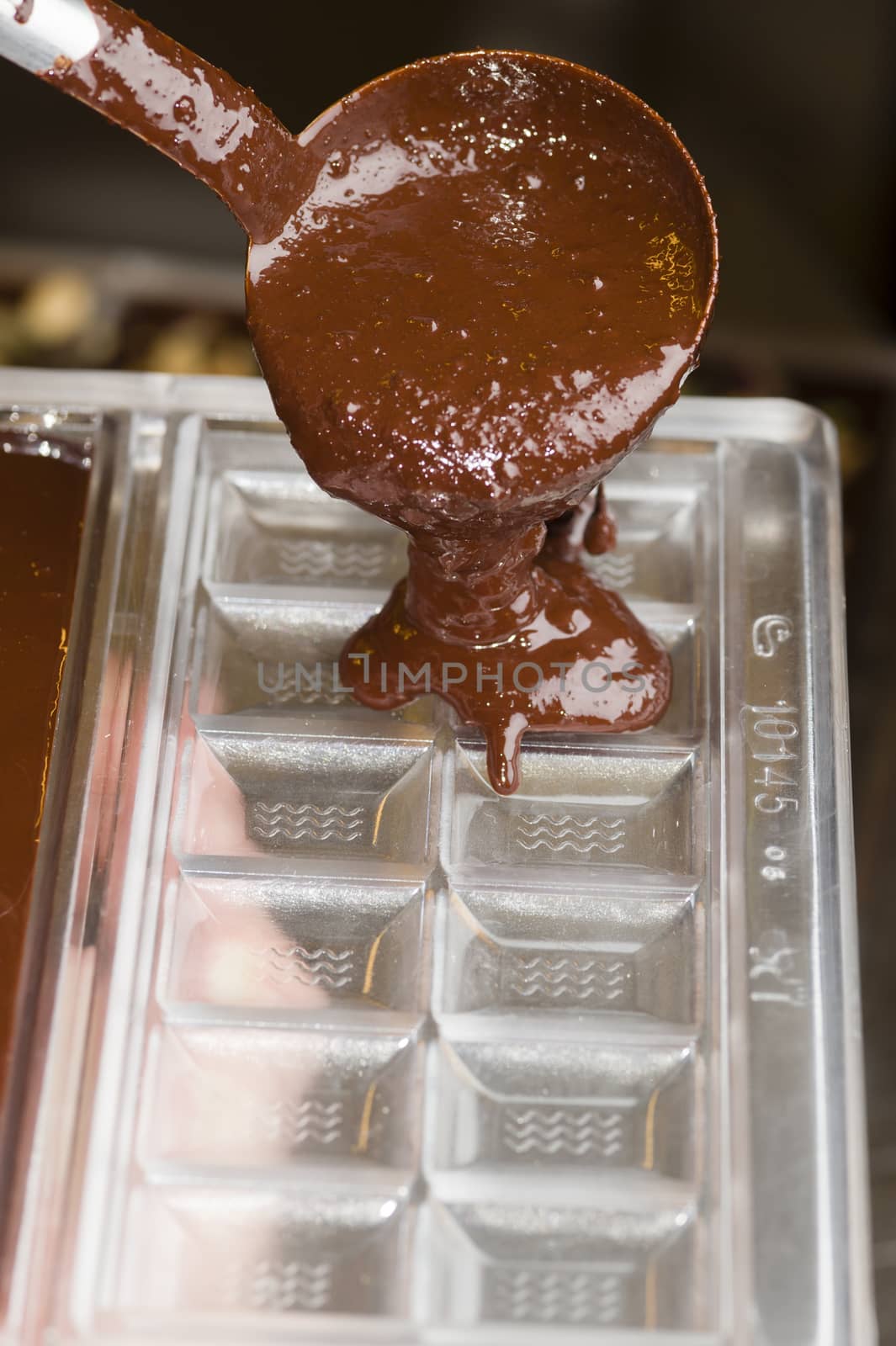 Mixed chocolate poured on bar mold