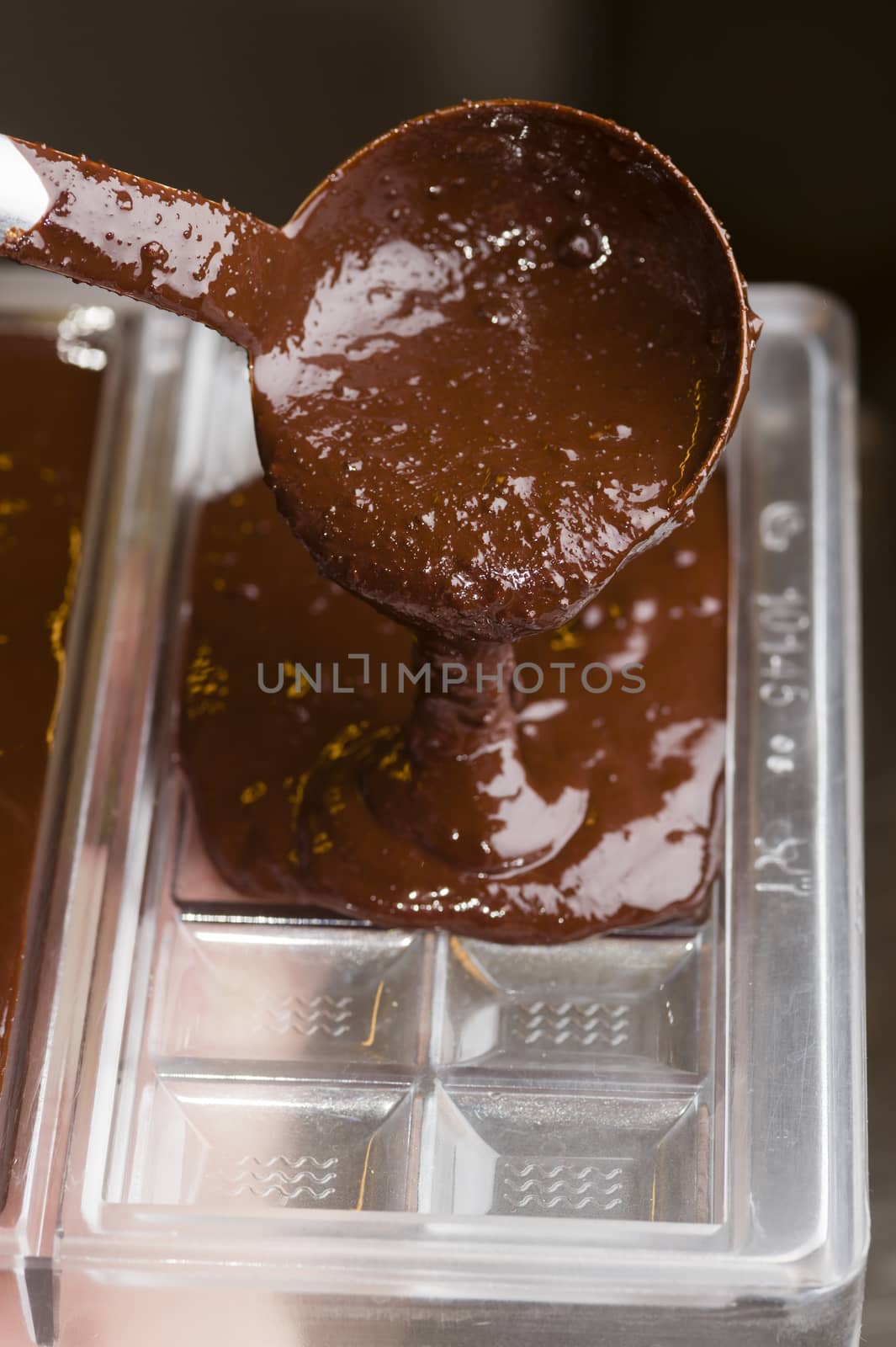 Mixed chocolate poured on bar mold