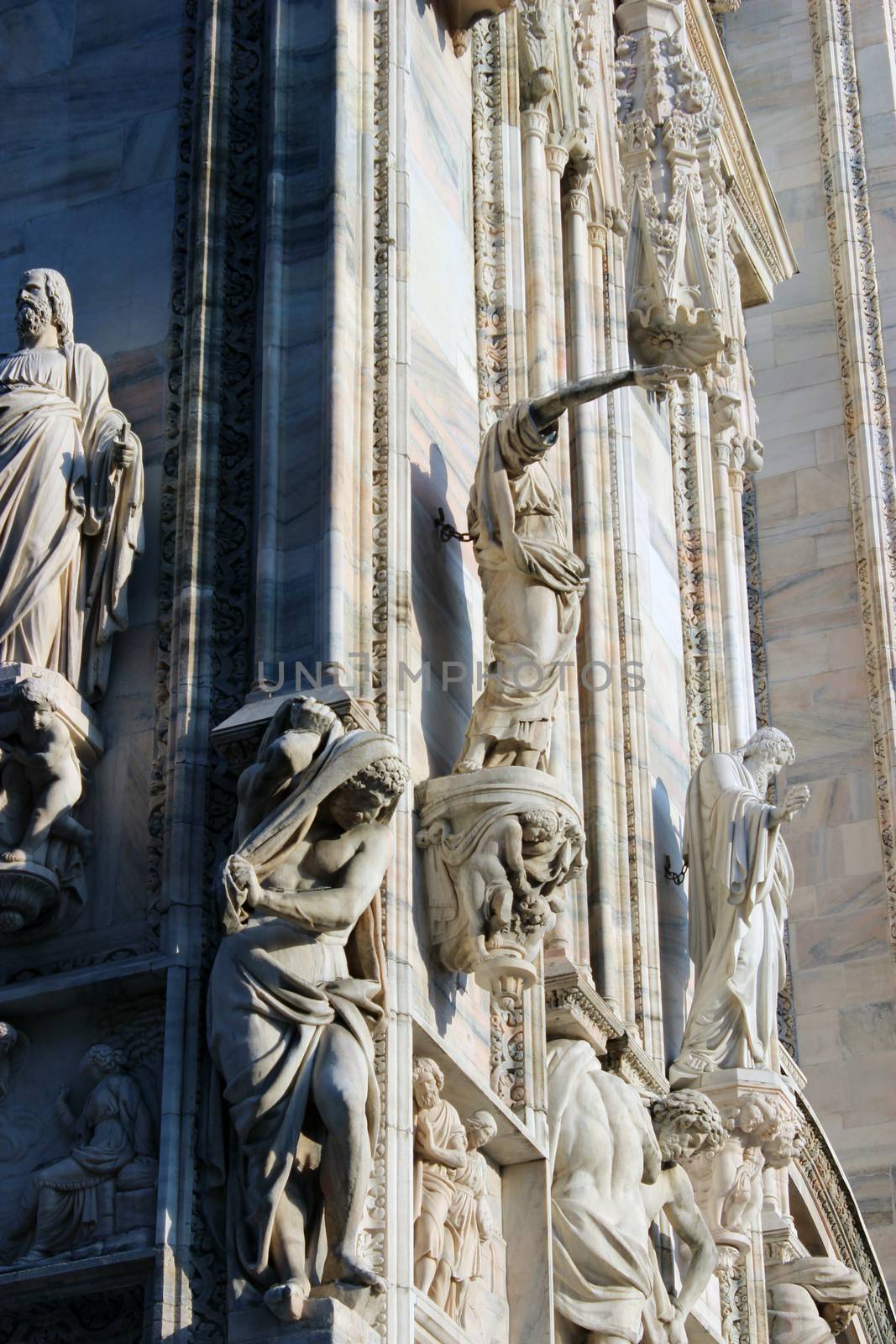 Milan Cathedral.Famous landmark marble saint sculptures detail
