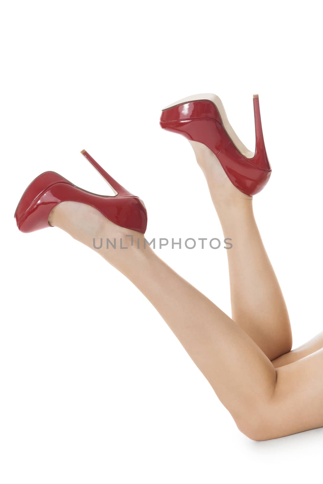 Flawless Woman Legs in Elegant Red High Heel Shoes, Isolated on White Background.