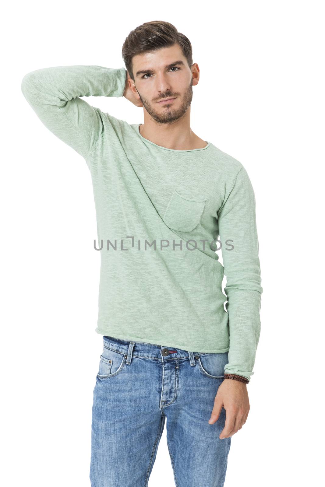 Puzzled handsome young man scratching his head with his hand as he looks at the camera with an uncertain perturbed expression, isolated on white