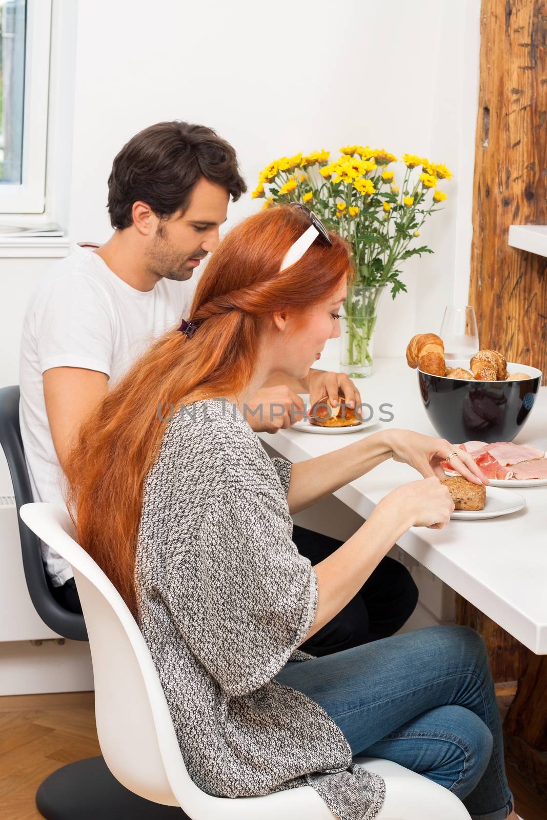 Couple Preparing Ham Sandwich at the Table by juniart