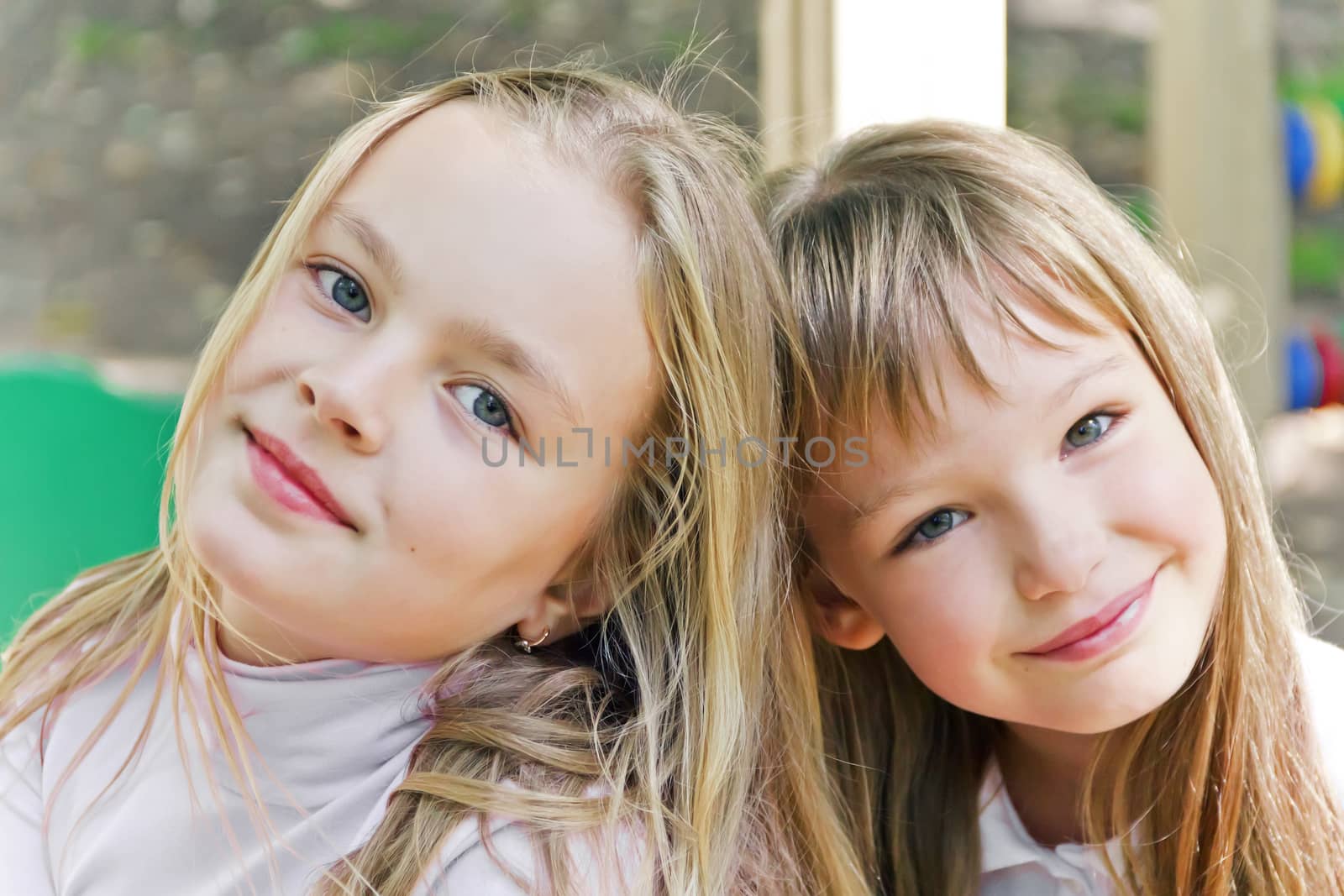 Photo of two cute girls with long hairs