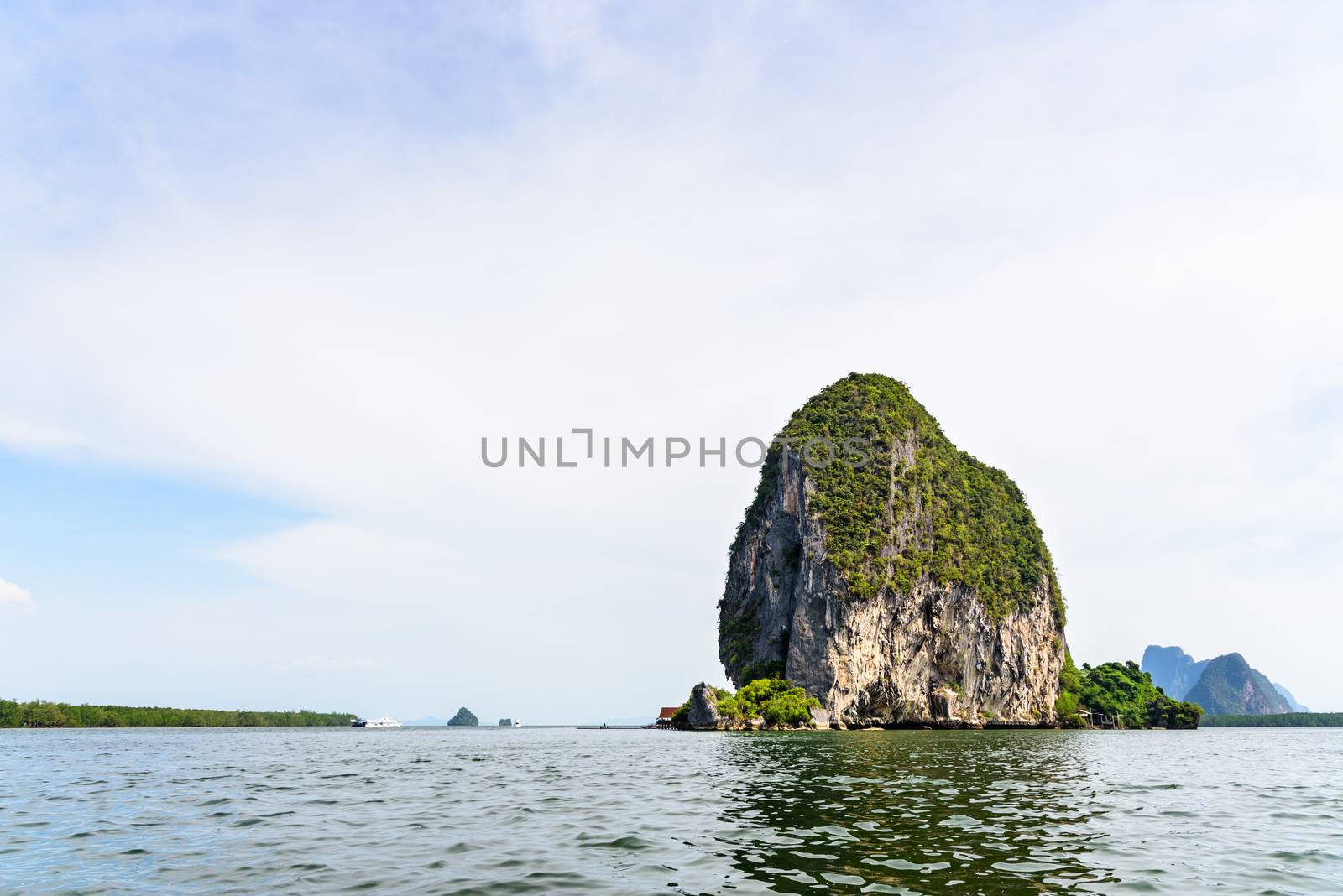 Beautiful landscape sky and sea. Back of Punyi Island or Koh Panyee during travel by boat in Phang Nga Bay or Ao Phang Nga National Park, Thailand