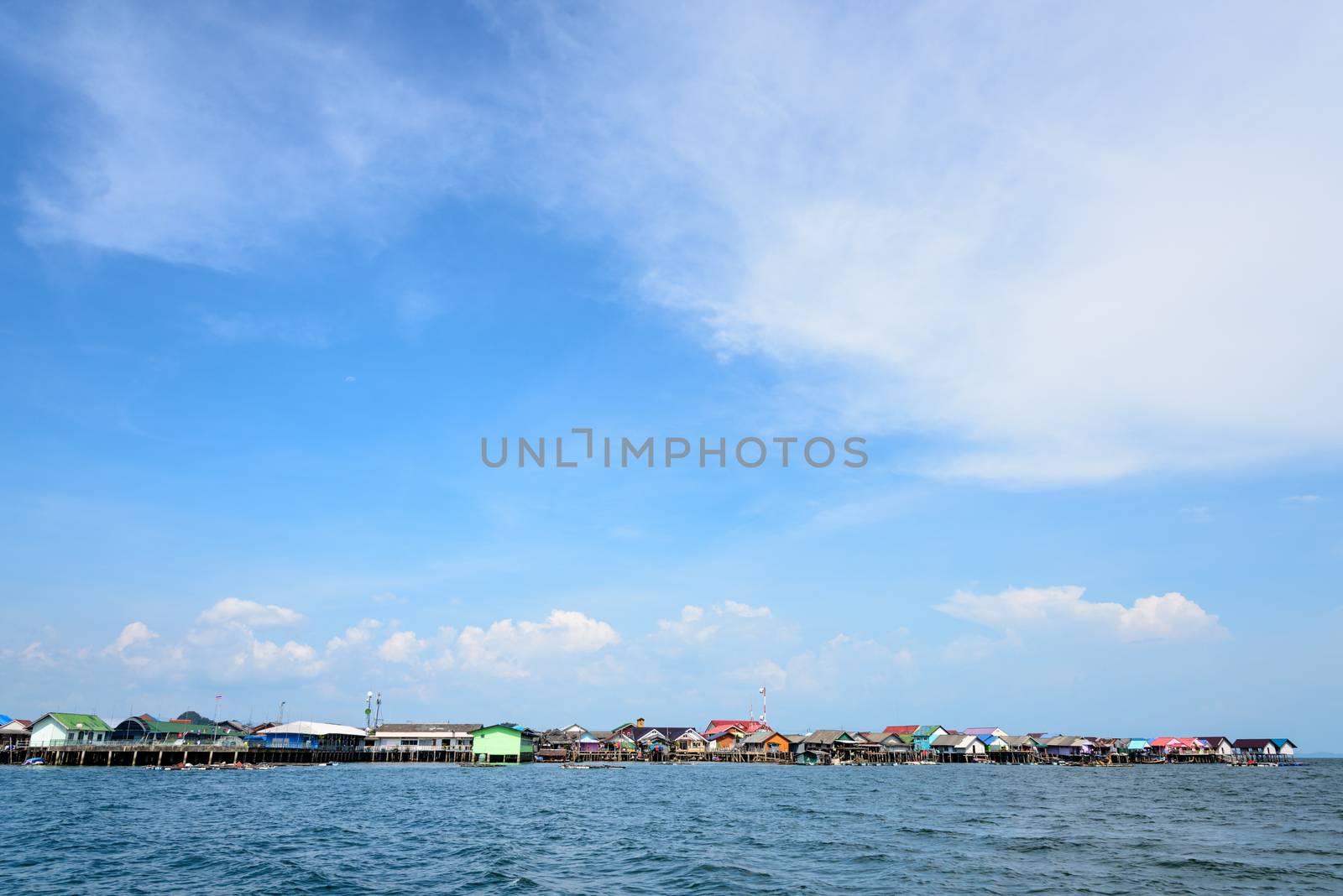 Blue sky background above fisherman village on the sea at Koh Panyee or Punyi island cultural attractions travel by boat in Phang Nga Bay or Ao Phang Nga National Park, Thailand