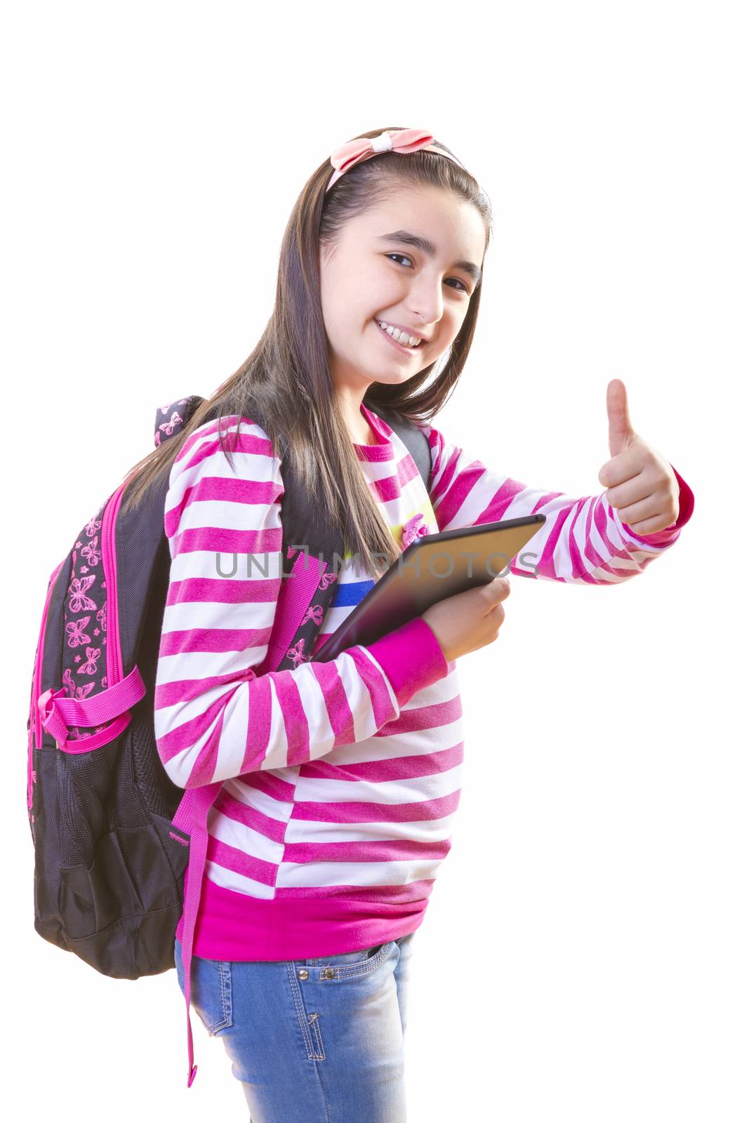 Beautiful teenager girl with backpack and digital tablet by manaemedia