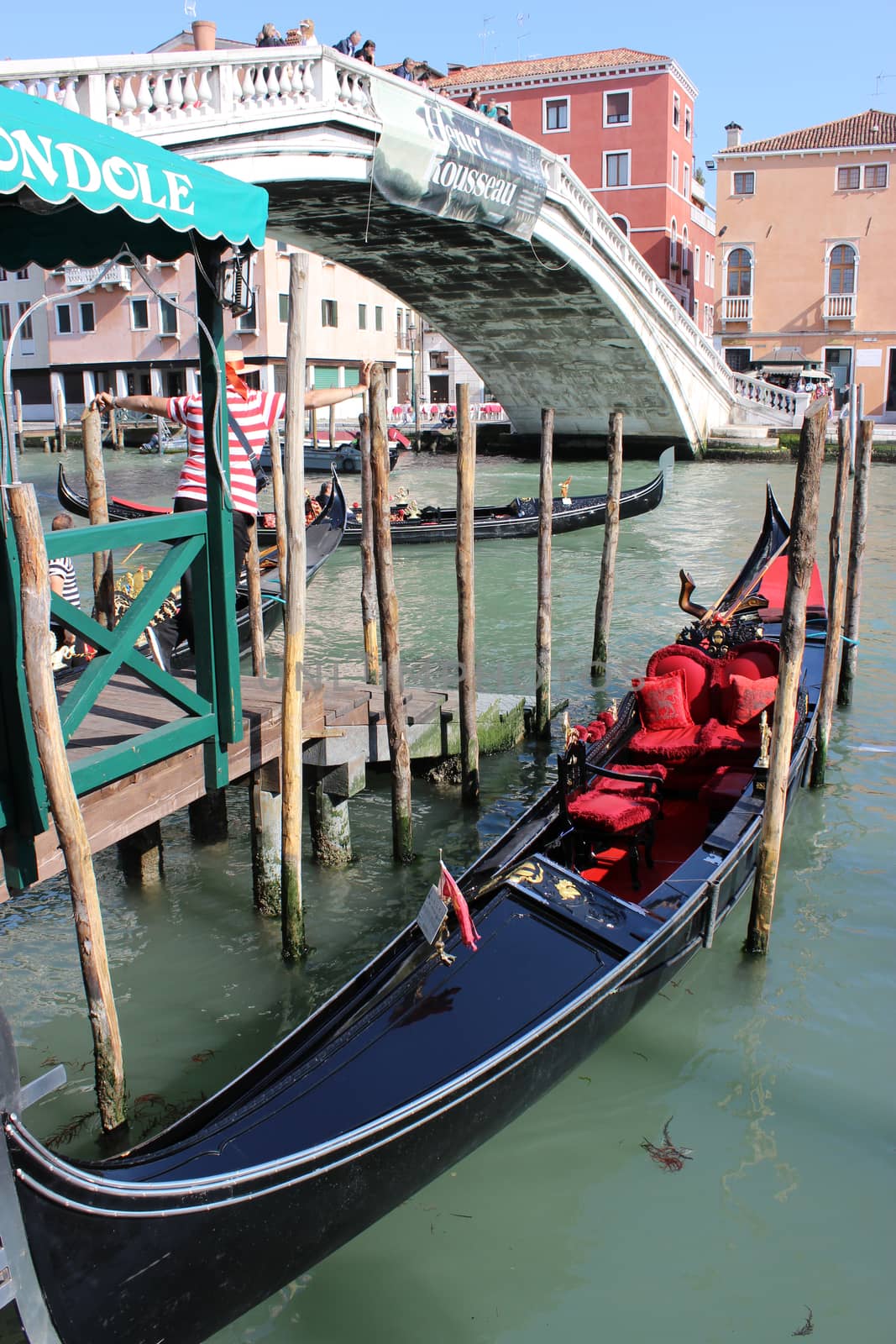 Gondolas and gondoliers on the Grand Canal in Venice, Italy by bensib
