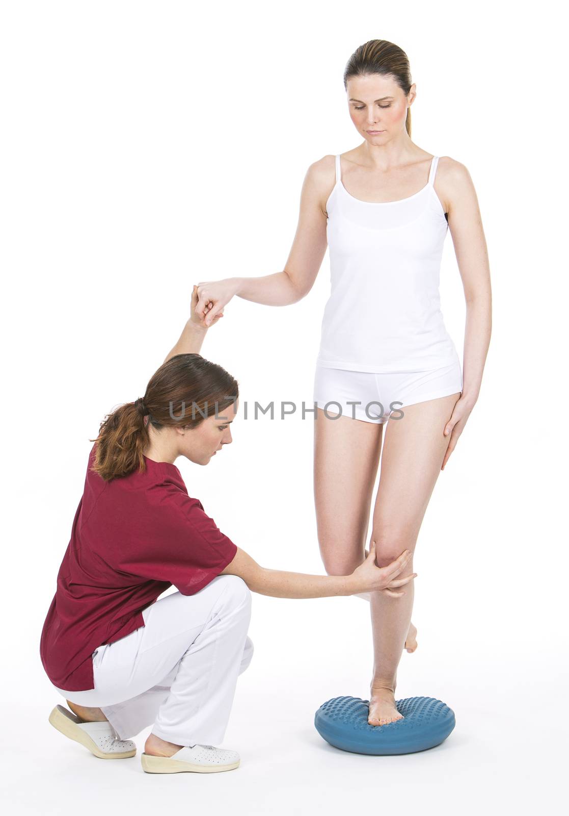 woman with physiotherapist by Flareimage