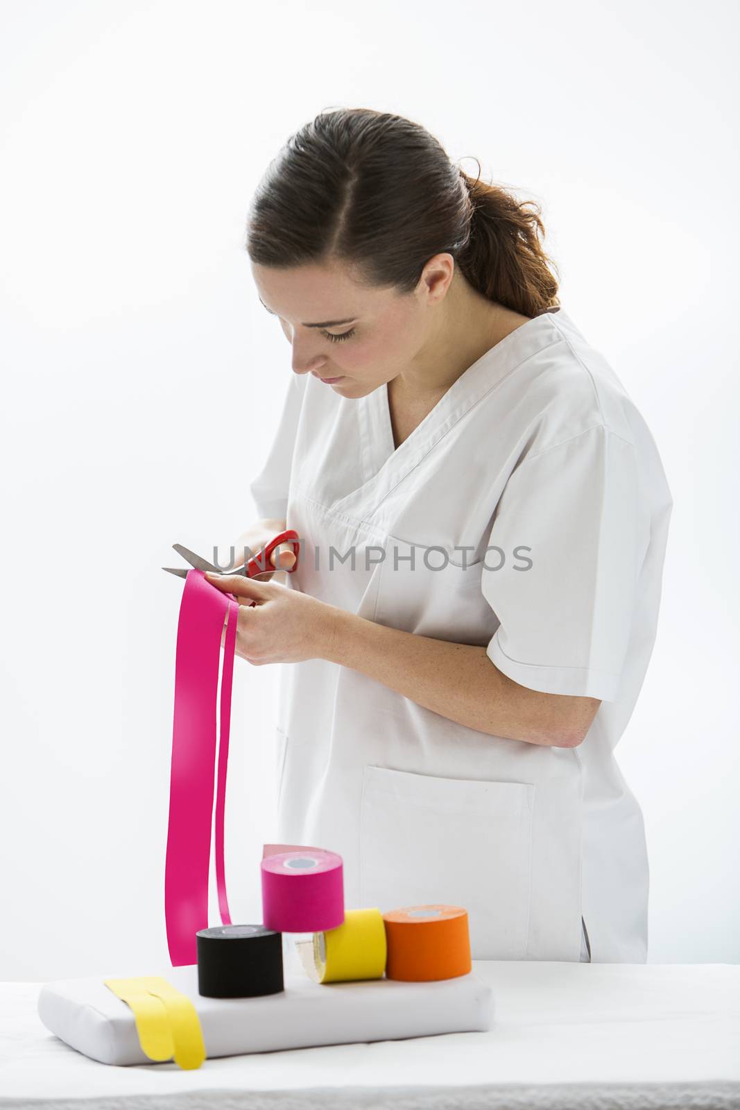 physiotherapist with tapes by Flareimage