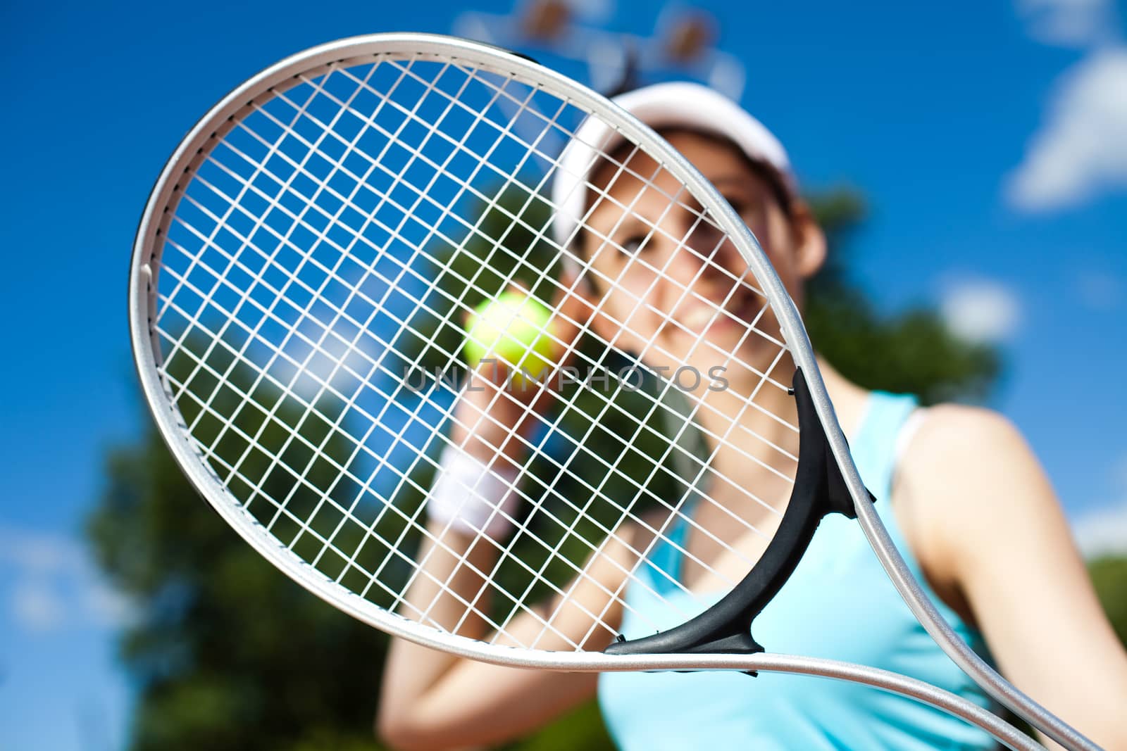 Woman playing tennis, summertime saturated theme