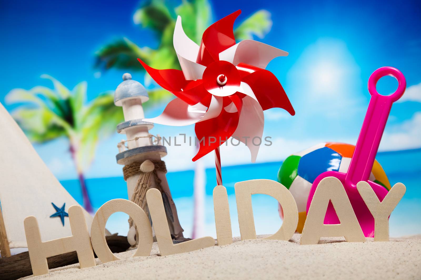 Colorful plastic toys on the beach