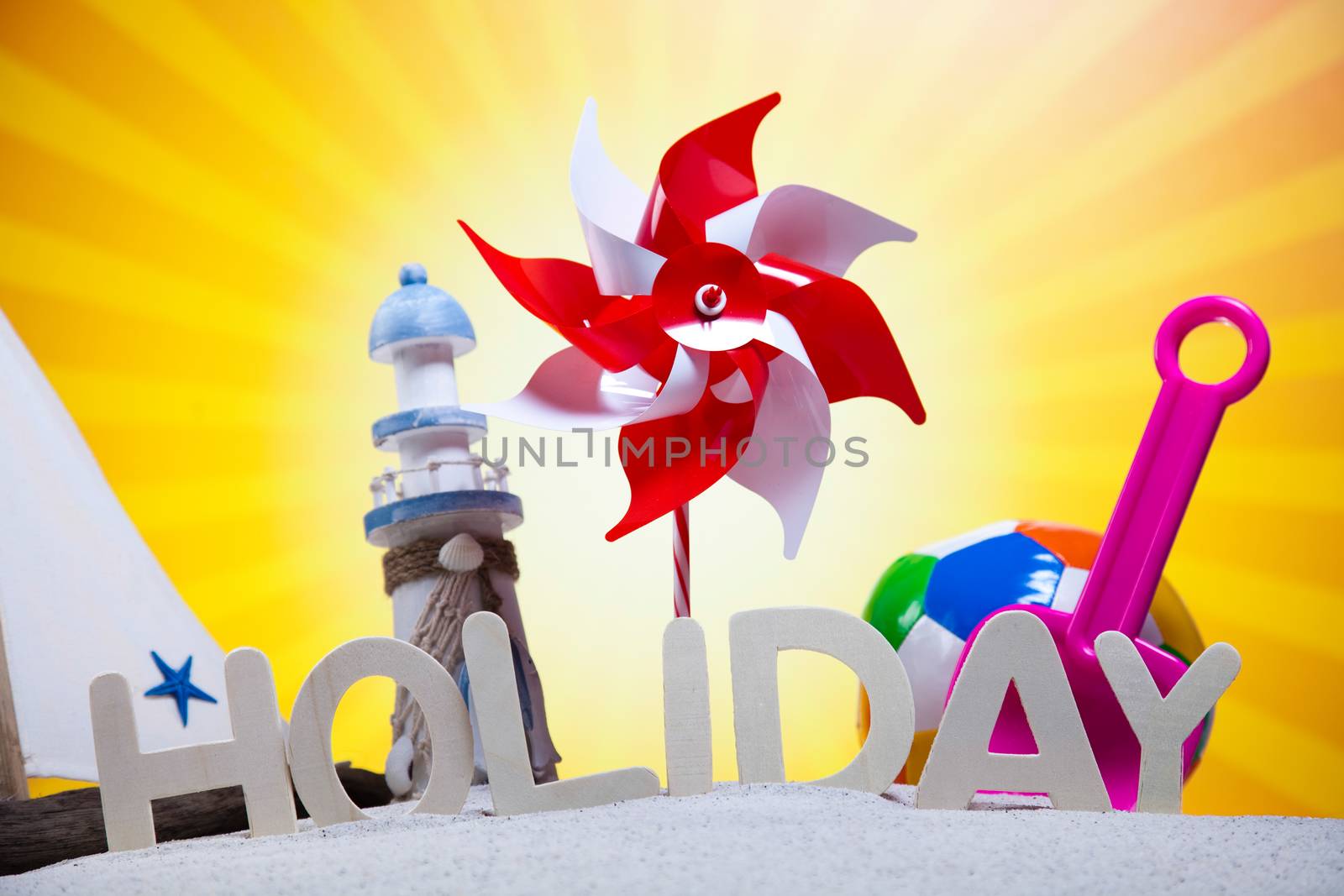 Colorful plastic toys on the beach
