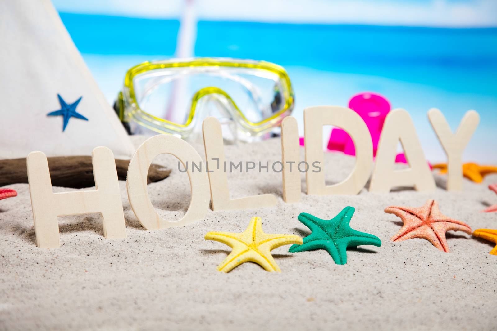 Colorful plastic toys on the beach