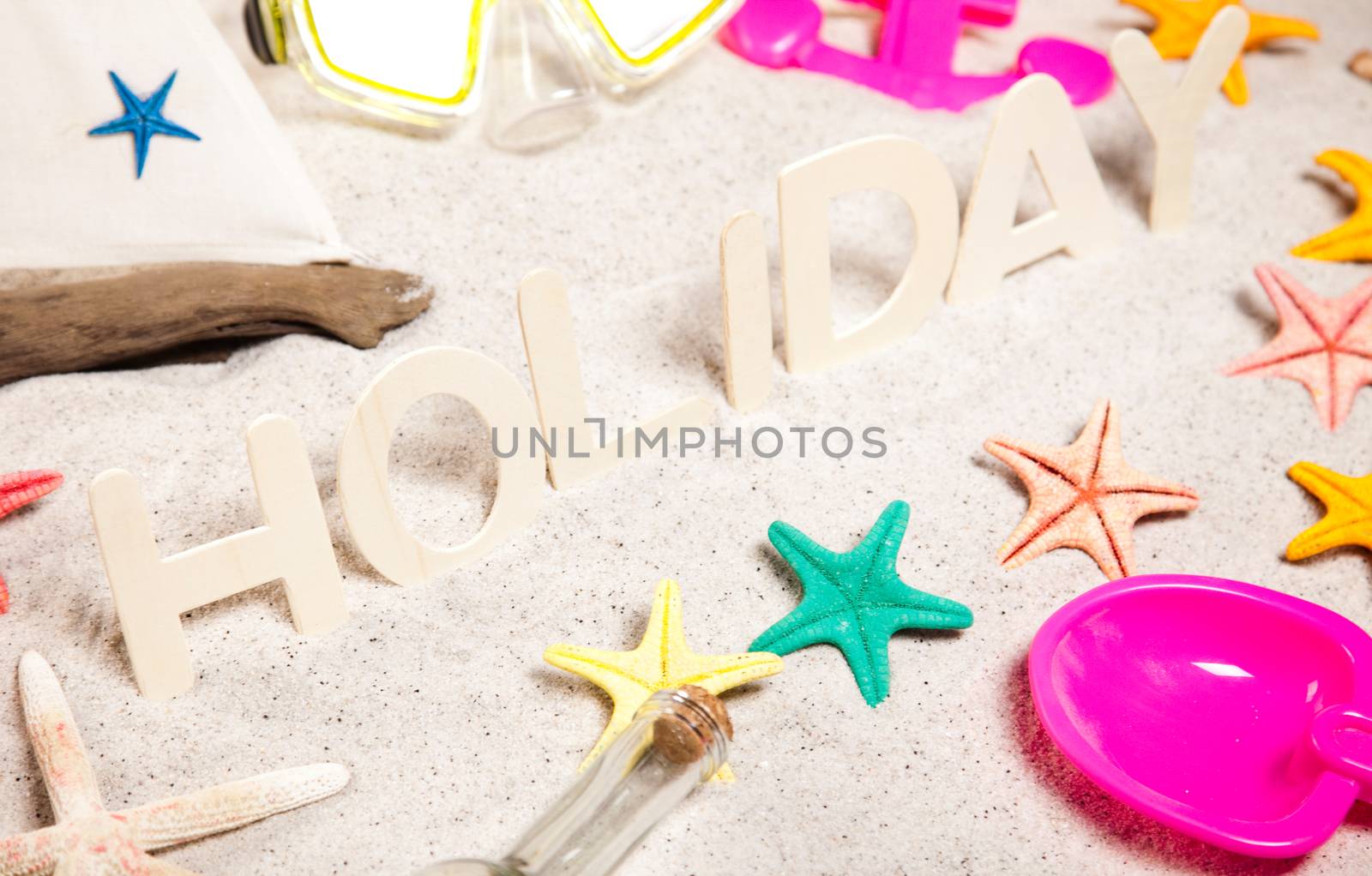 Colorful plastic toys on the beach