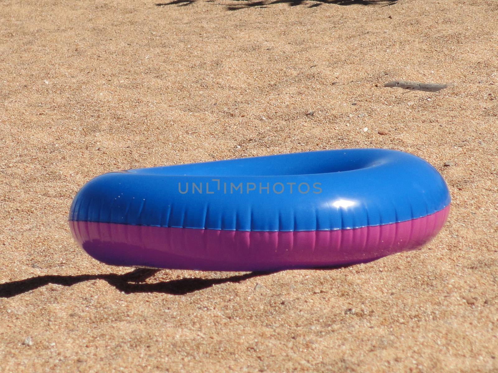 Pink and blue life ring on the beach, Lake Tahoe USA