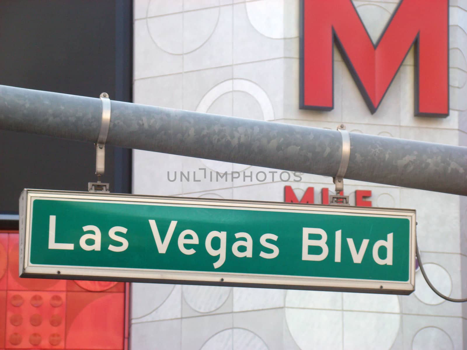 Green road sign hanging from a pole, Las Vegas Strip 