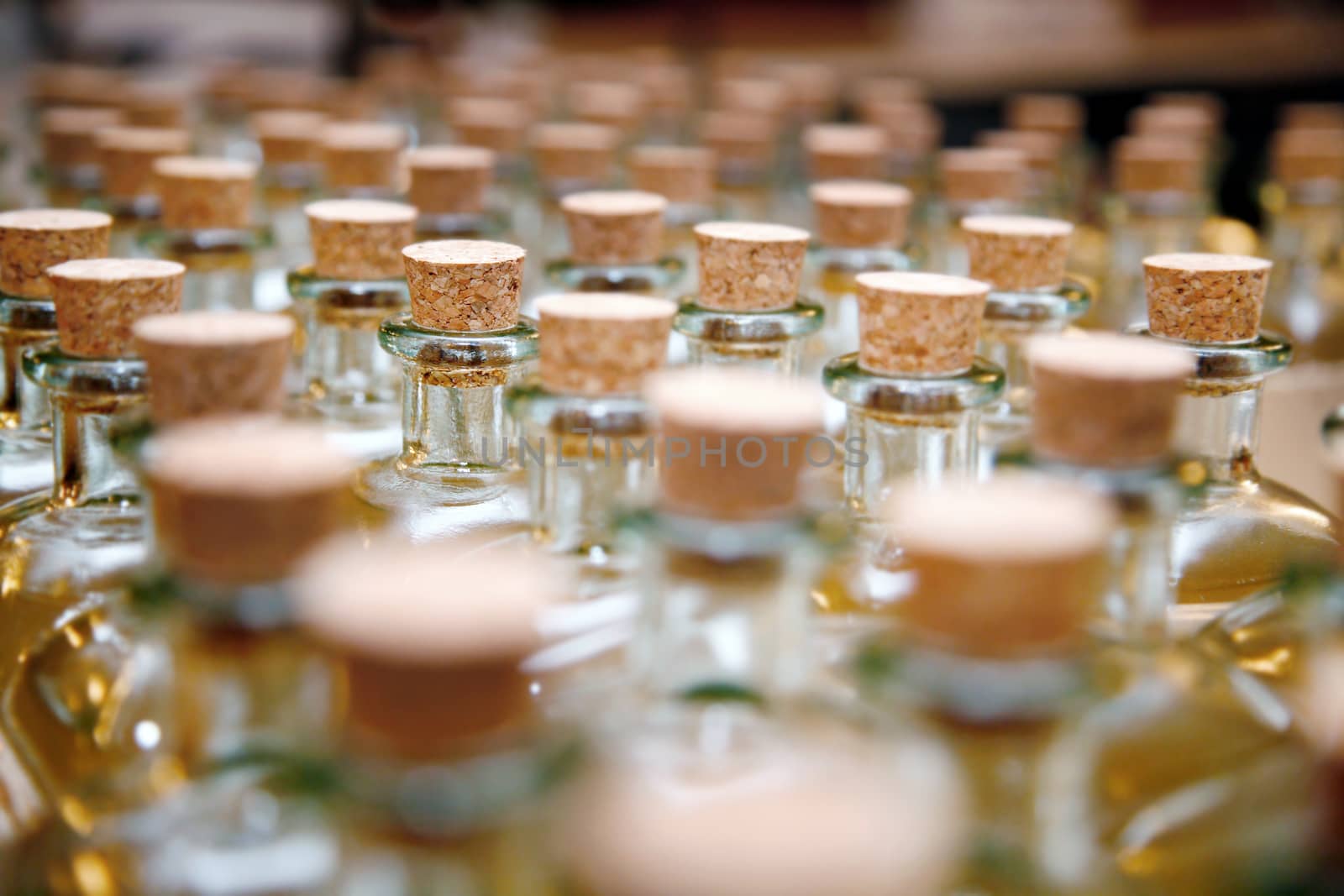 Row of glass storage jars with corks.