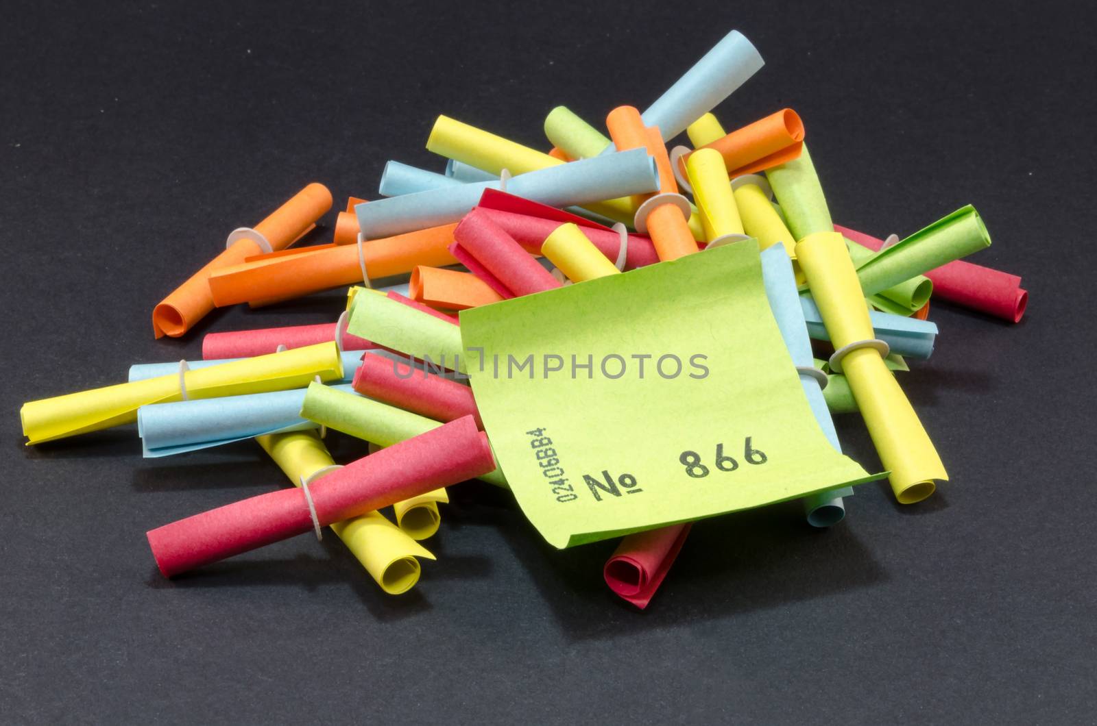 Winning tickets, lottery tickets different colors against white background.