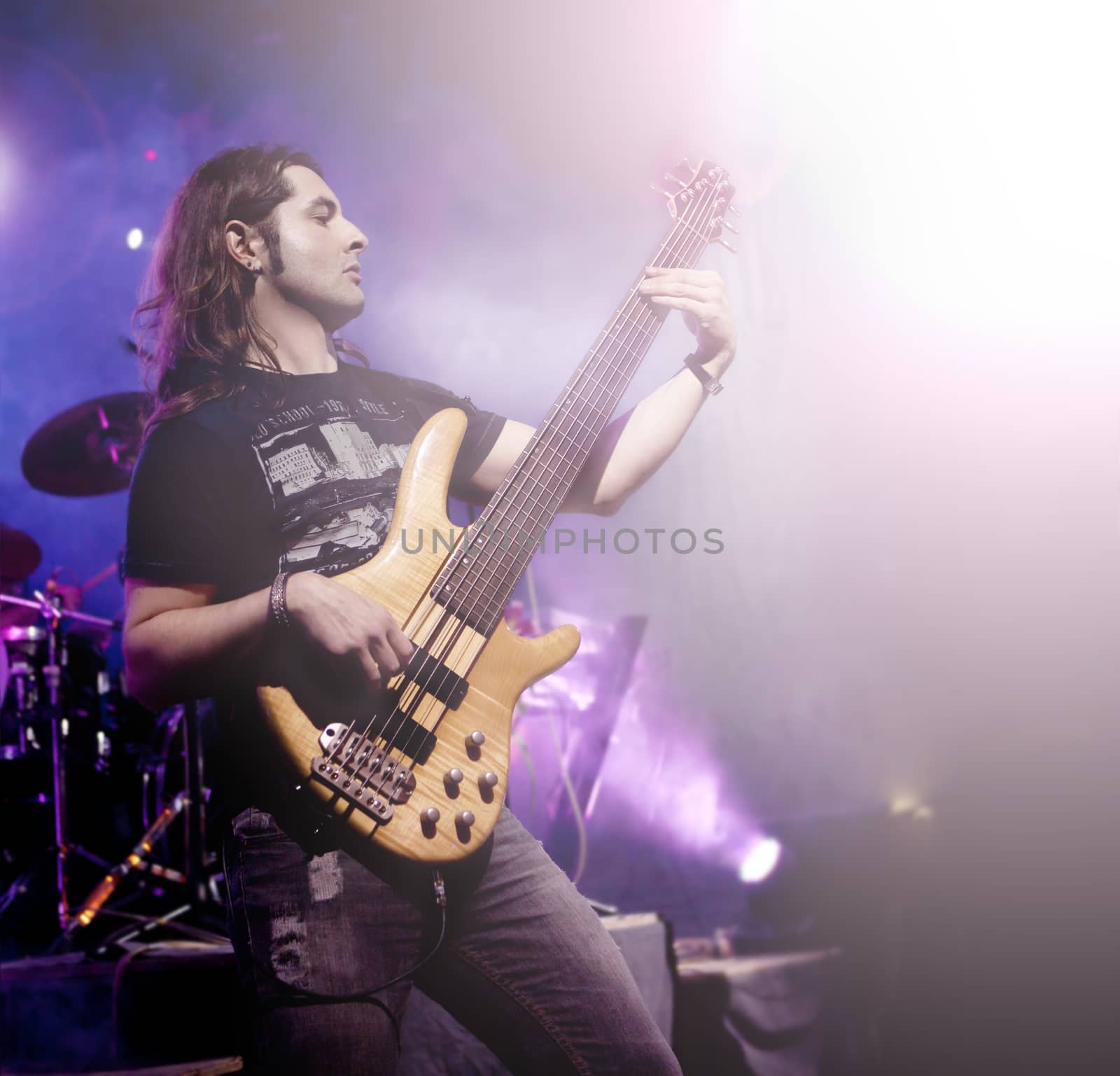Man playing electric bass live. Concept live music. by Ainat