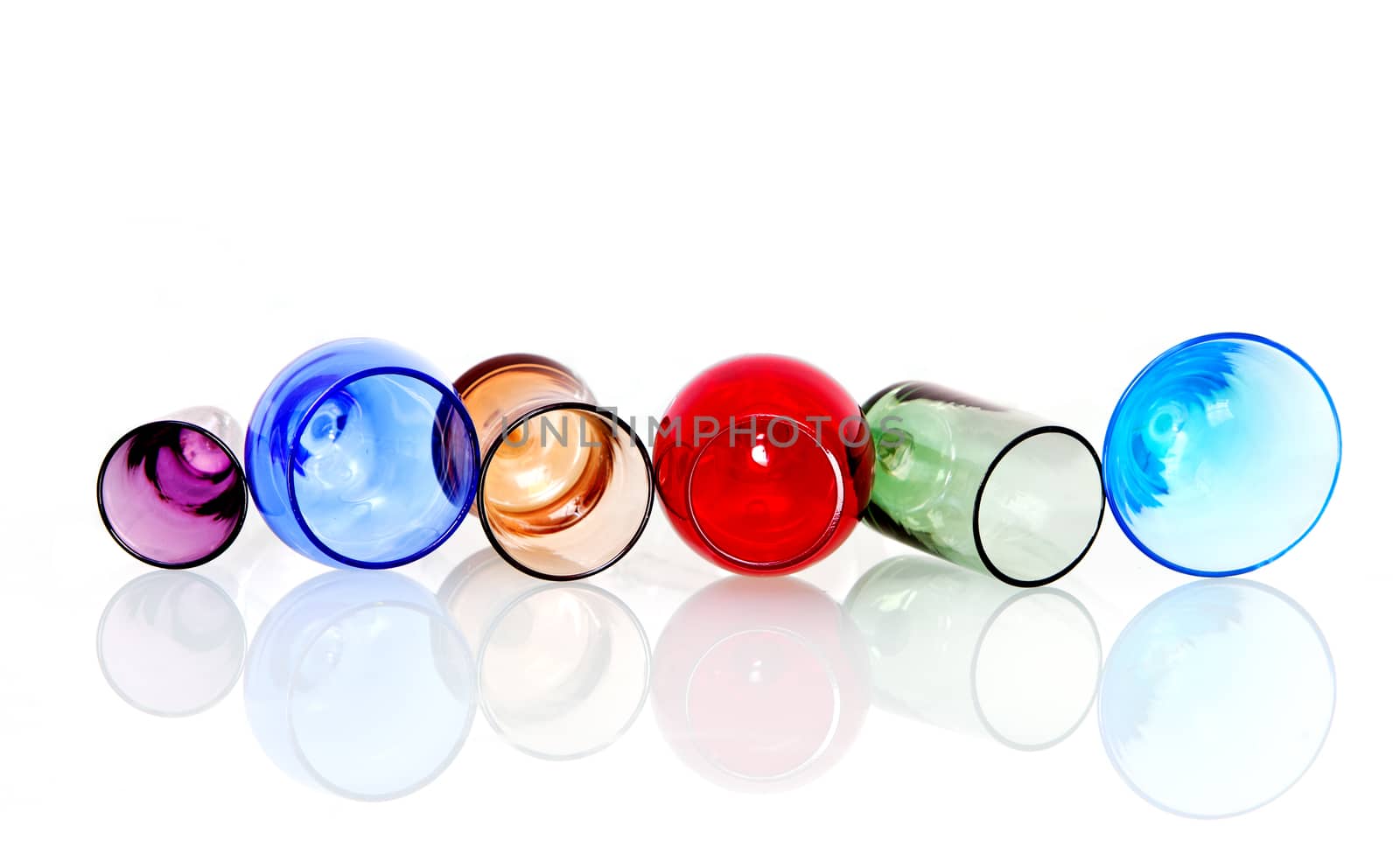 Abstract image of colored circles with crystal glasses and reflection on white background