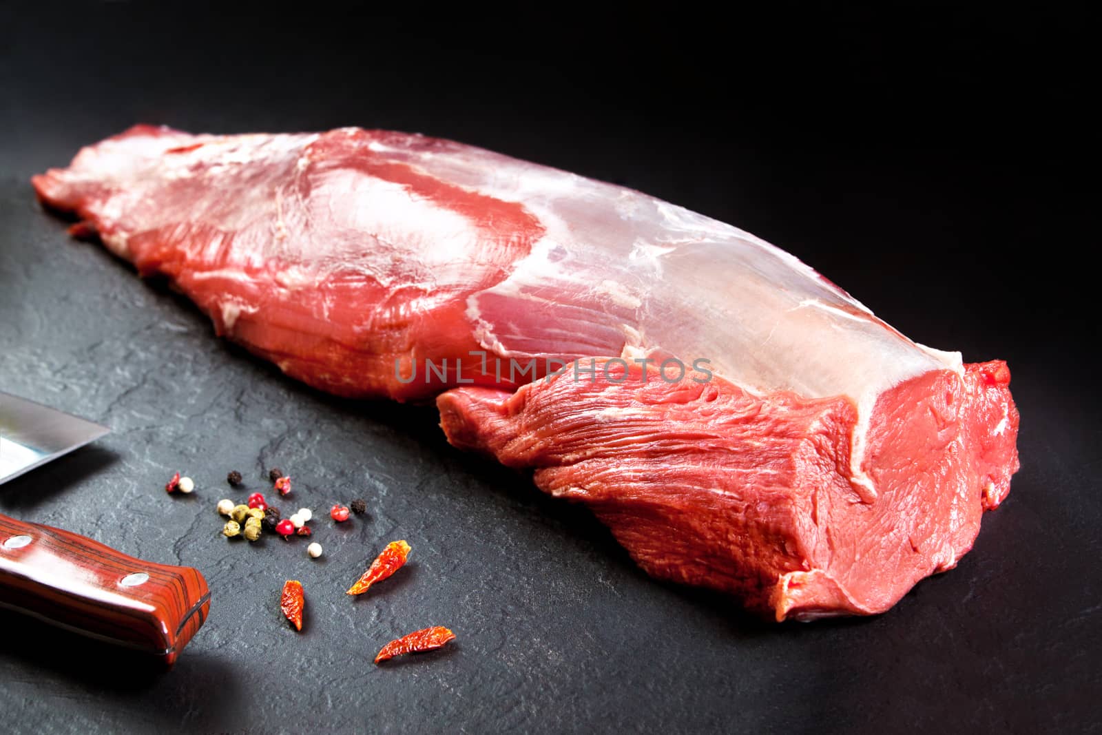 Fresh and raw meat. whole piece of Sirloin  steaks in a row ready to cook. Background black blackboard by Ainat