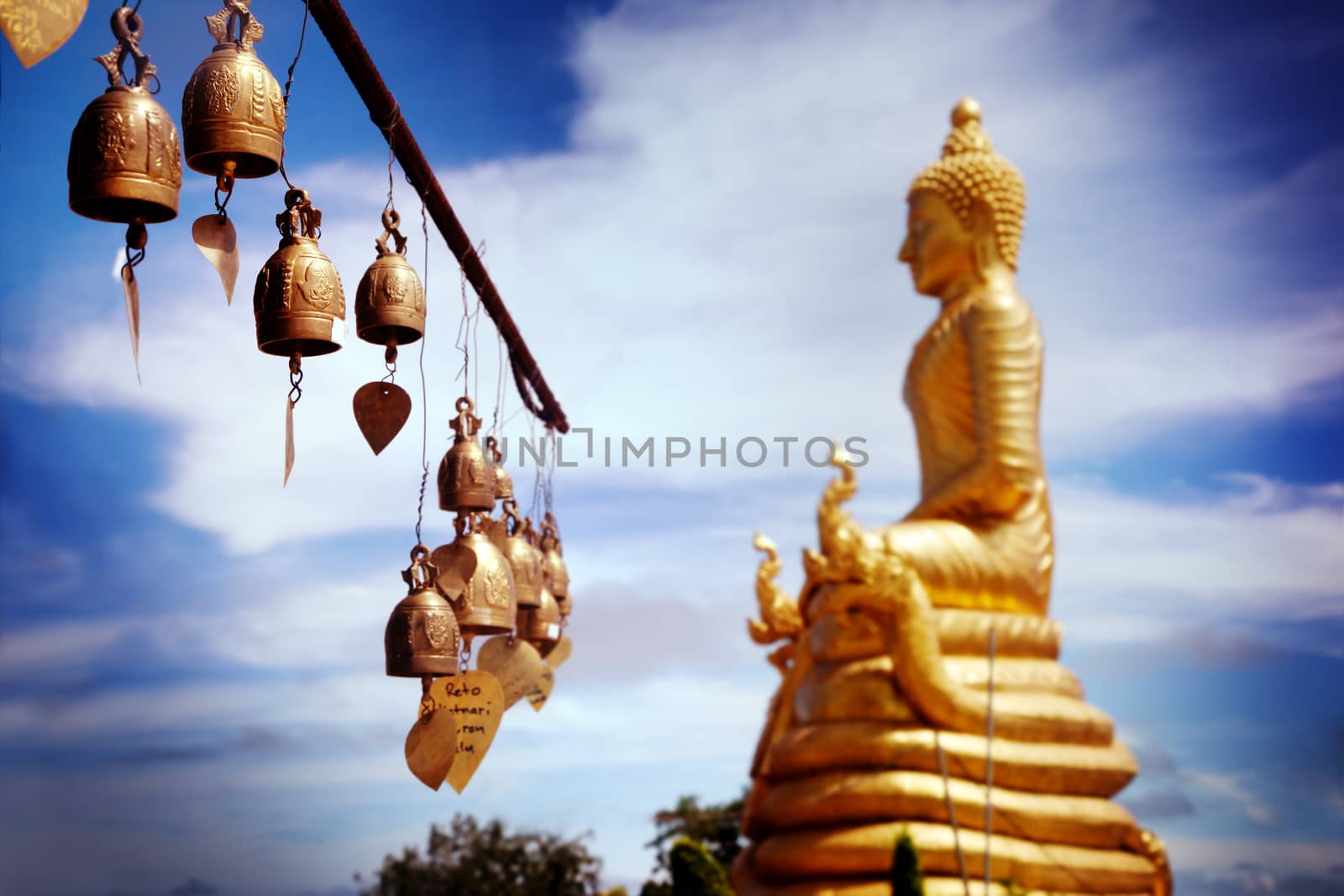 Row of golden bells in buddhist temple. big buddha in Thailand. Travel to Asia. Buddha mountain