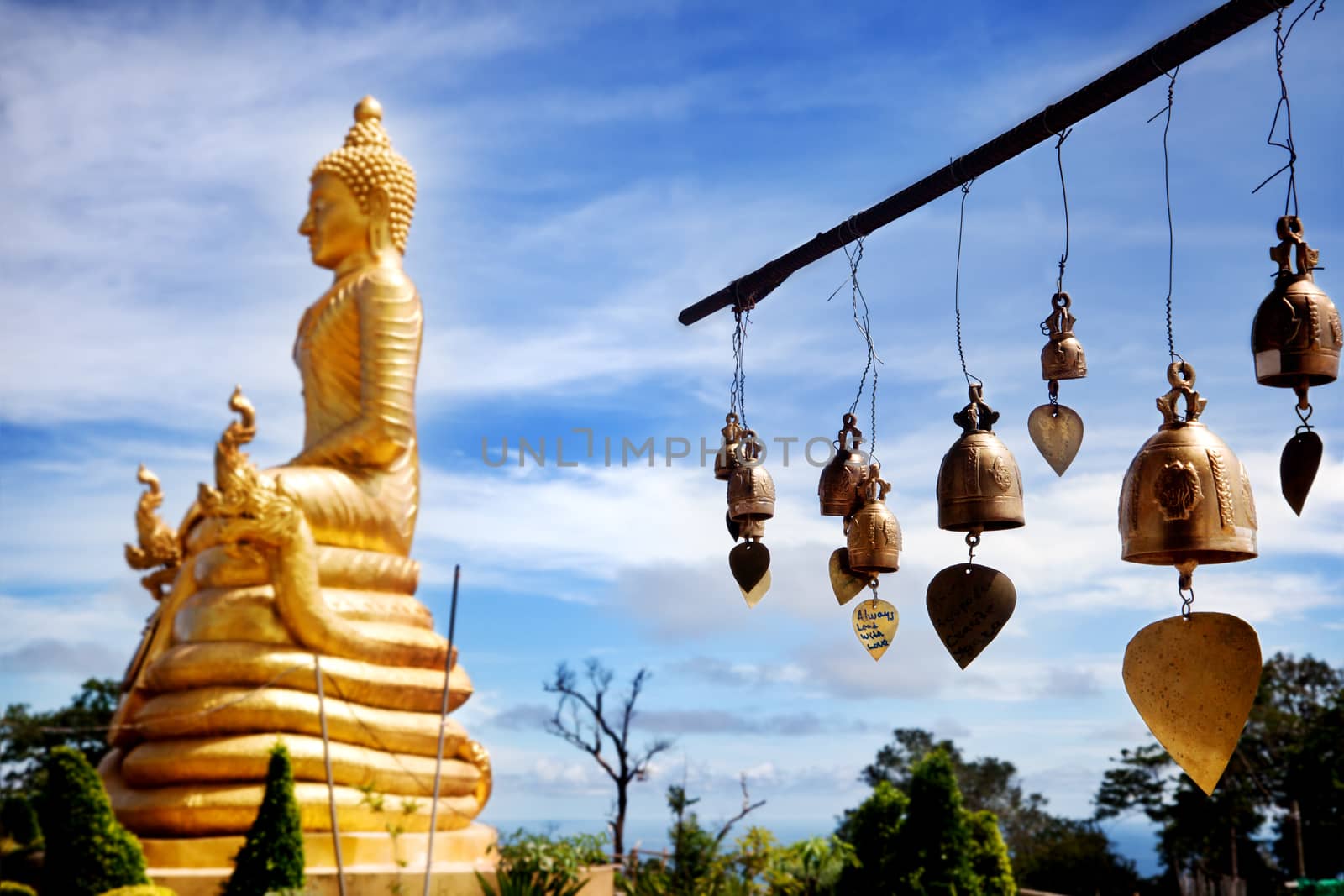 Row of golden bells in buddhist temple. big buddha in Thailand. Travel to Asia. Buddha mountain