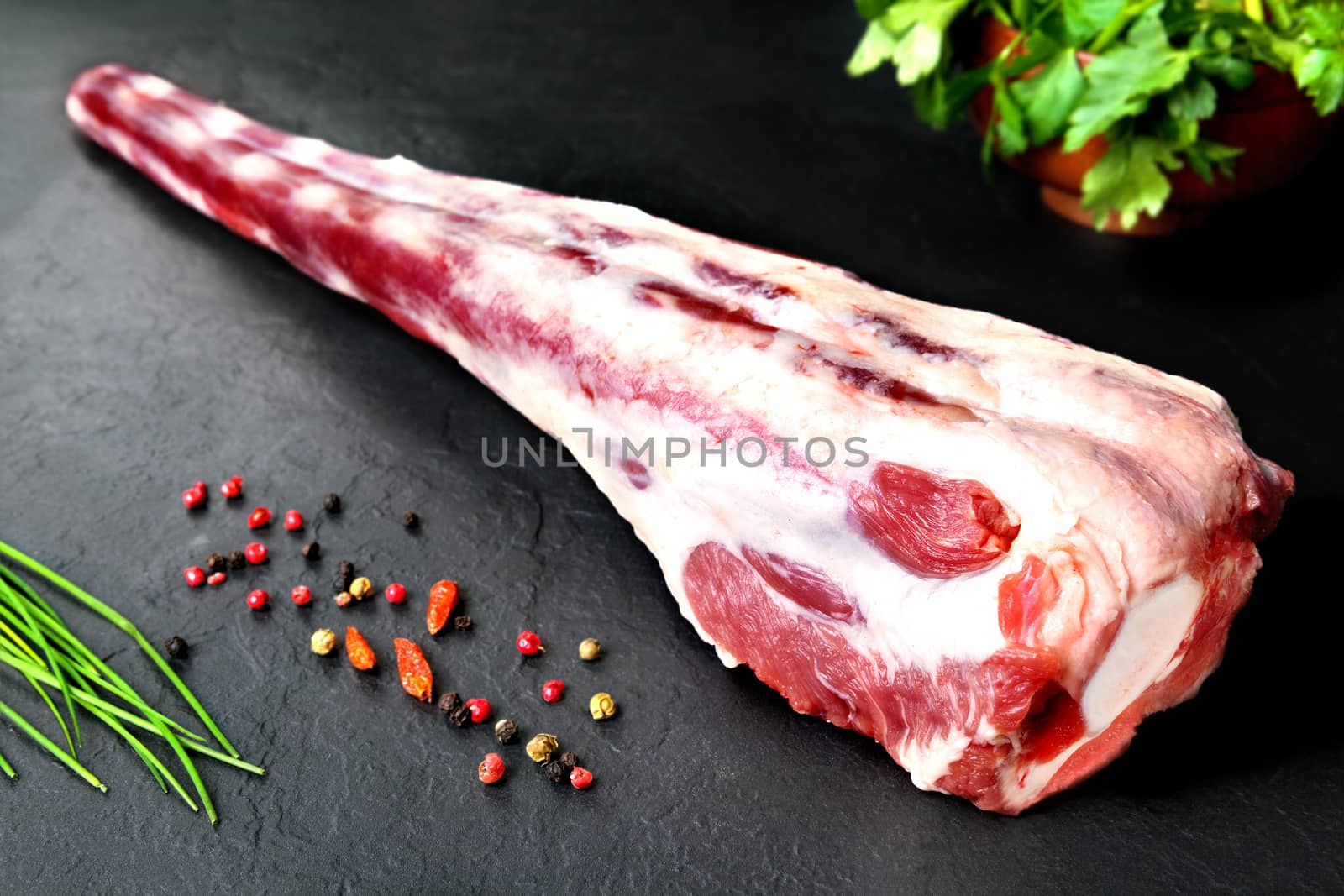 Fresh and raw meat. Raw oxtail ready to cook. Background black blackboard  by Ainat