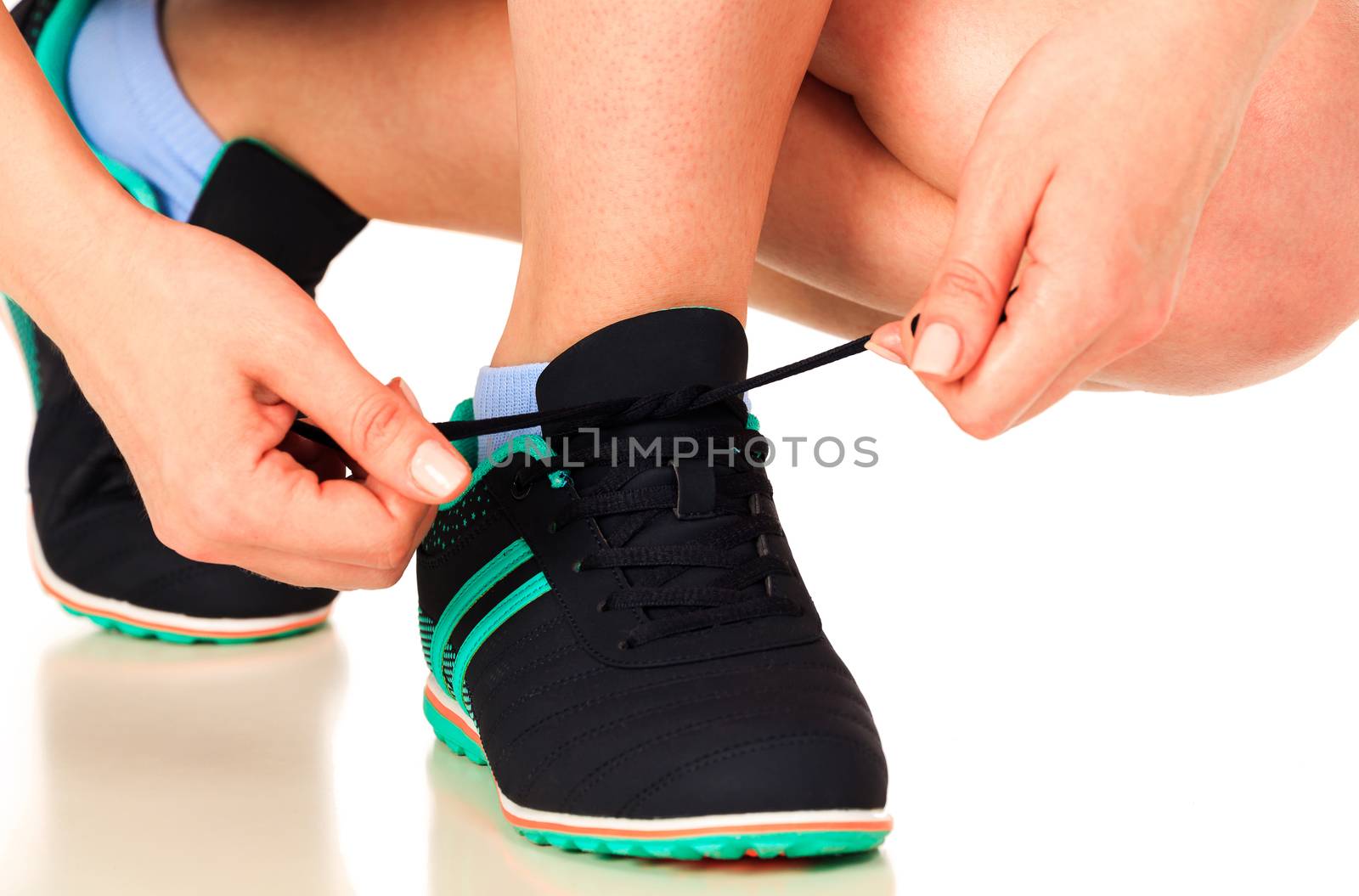 Running shoes being tied by woman, white background, isolated, copyspace