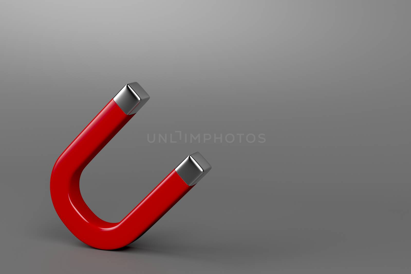 Red horseshoe magnet on gray background