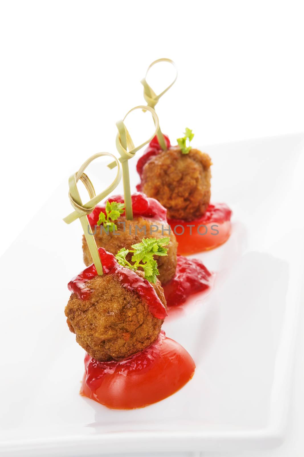 Delicious meatballs canape isolated on white background. Fresh modern image language. Culinary arts. 