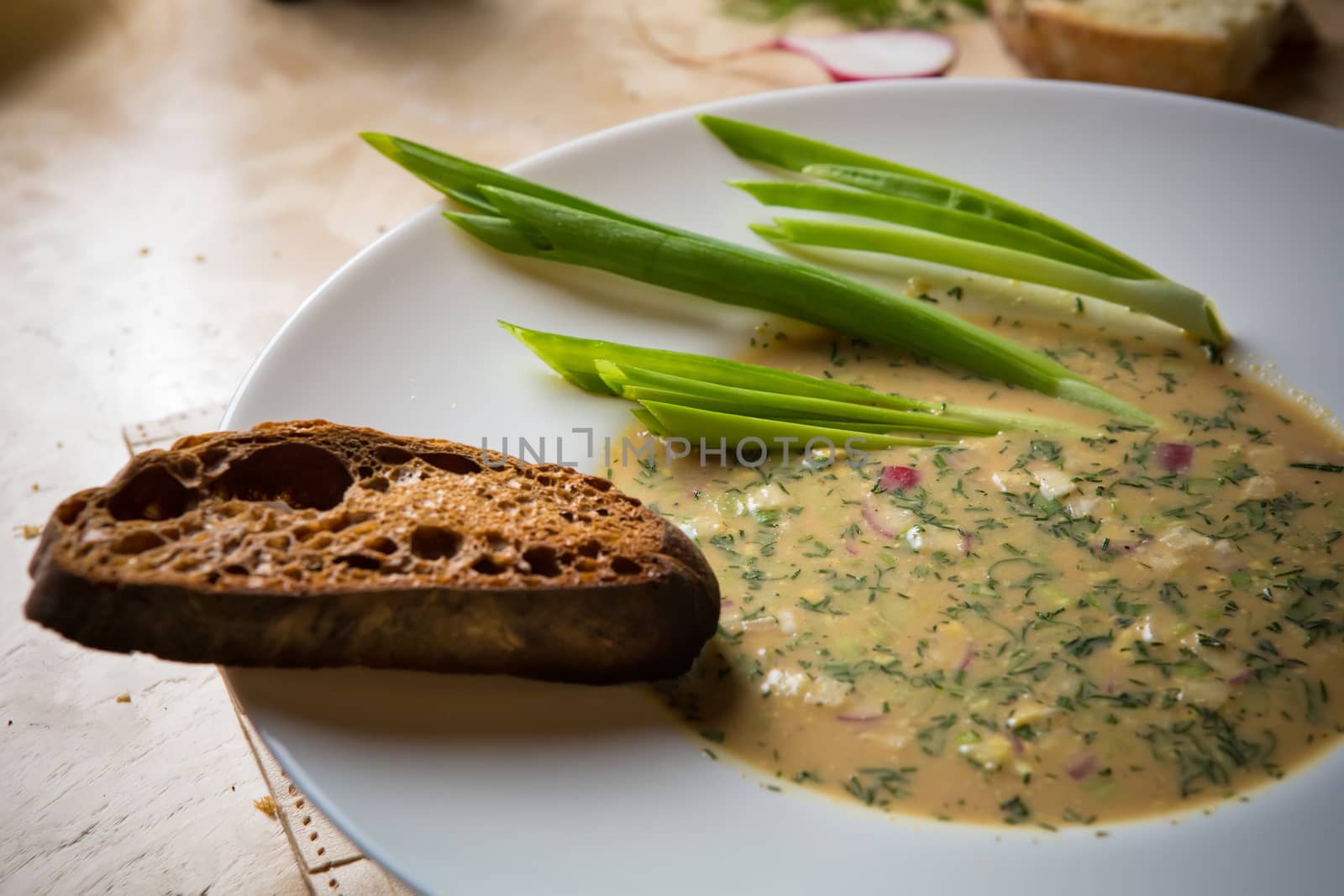 Traditional Russian kvass soup with vegetables - okroshka