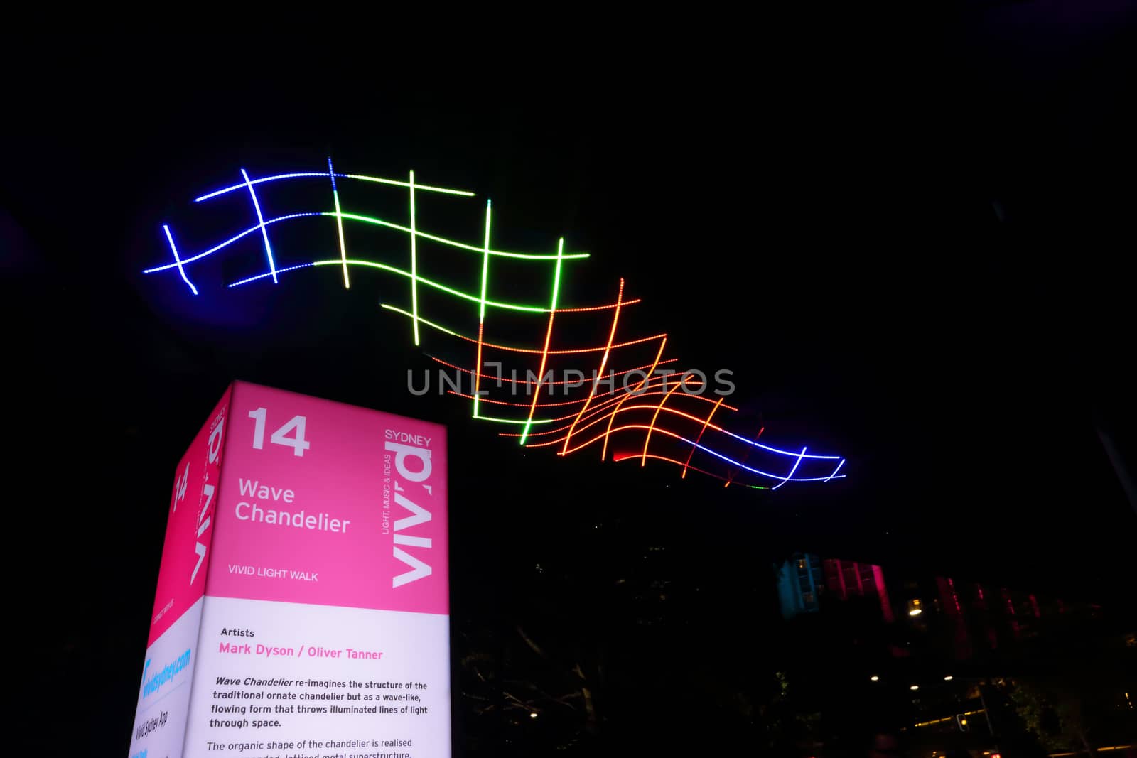 SYDNEY, AUSTRALIA - MAY 27, 2015; The Circular Quay walkway illuminated by this beautiful colourful wave form chandelier  that changes colours in a flowing form.  Artist Mark Dyson, Oliver Tanner