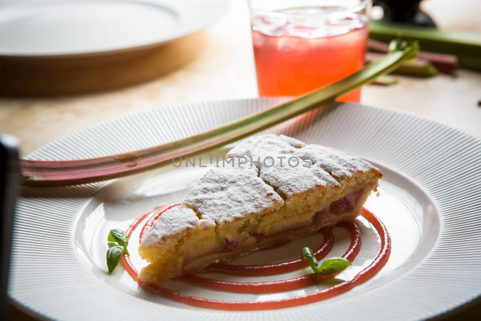 delicious rhubarb cake on white plate. sweet food