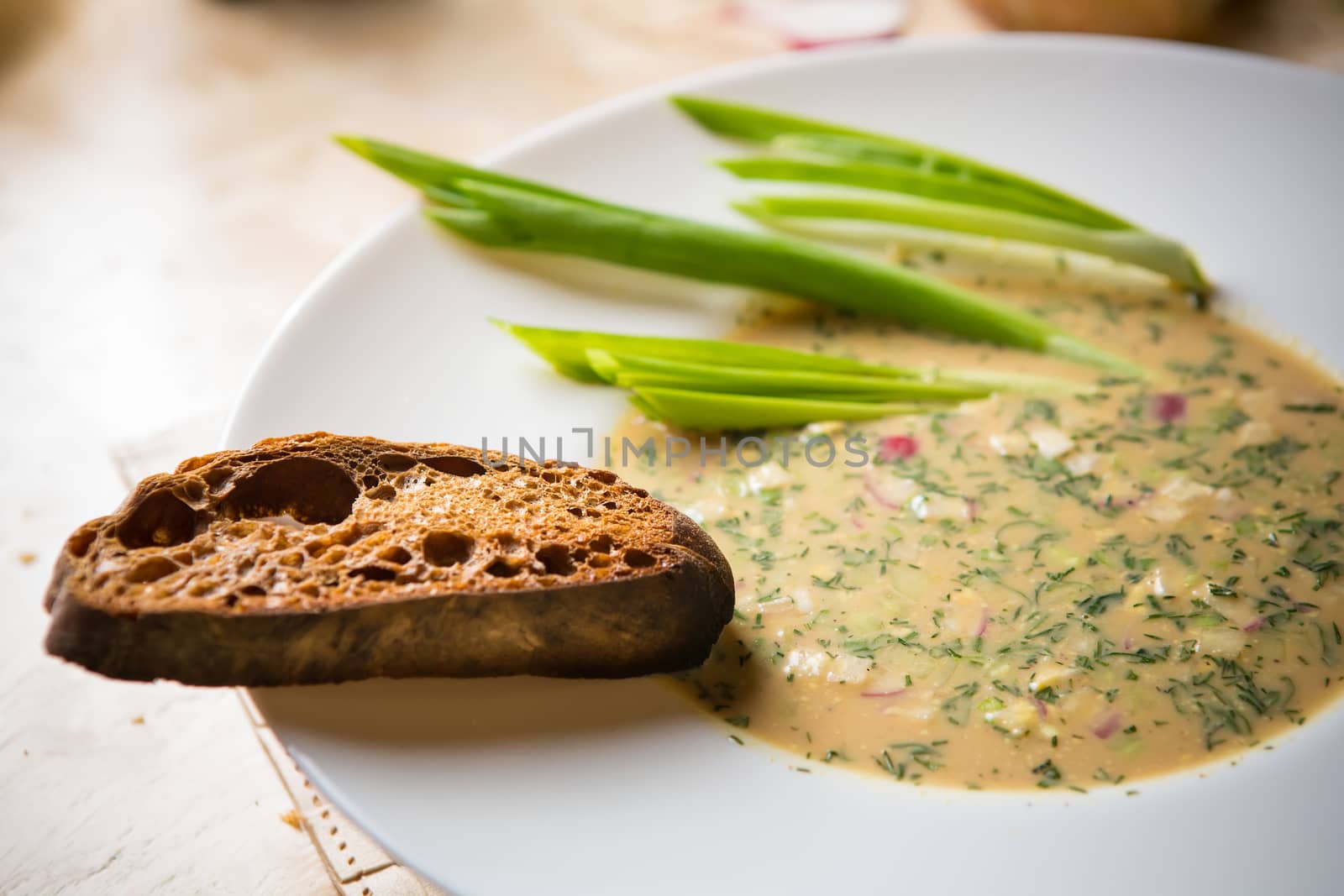 Traditional Russian kvass soup with vegetables - okroshka