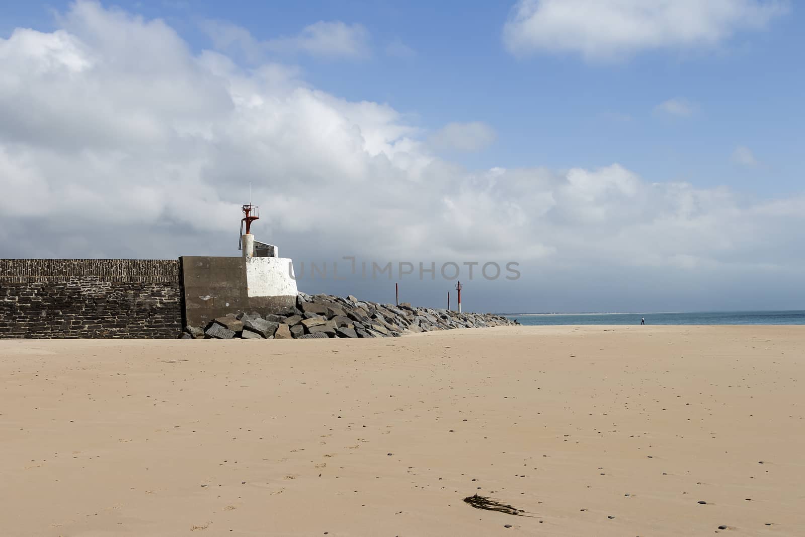 A gate to the ocean/harbor on low tide