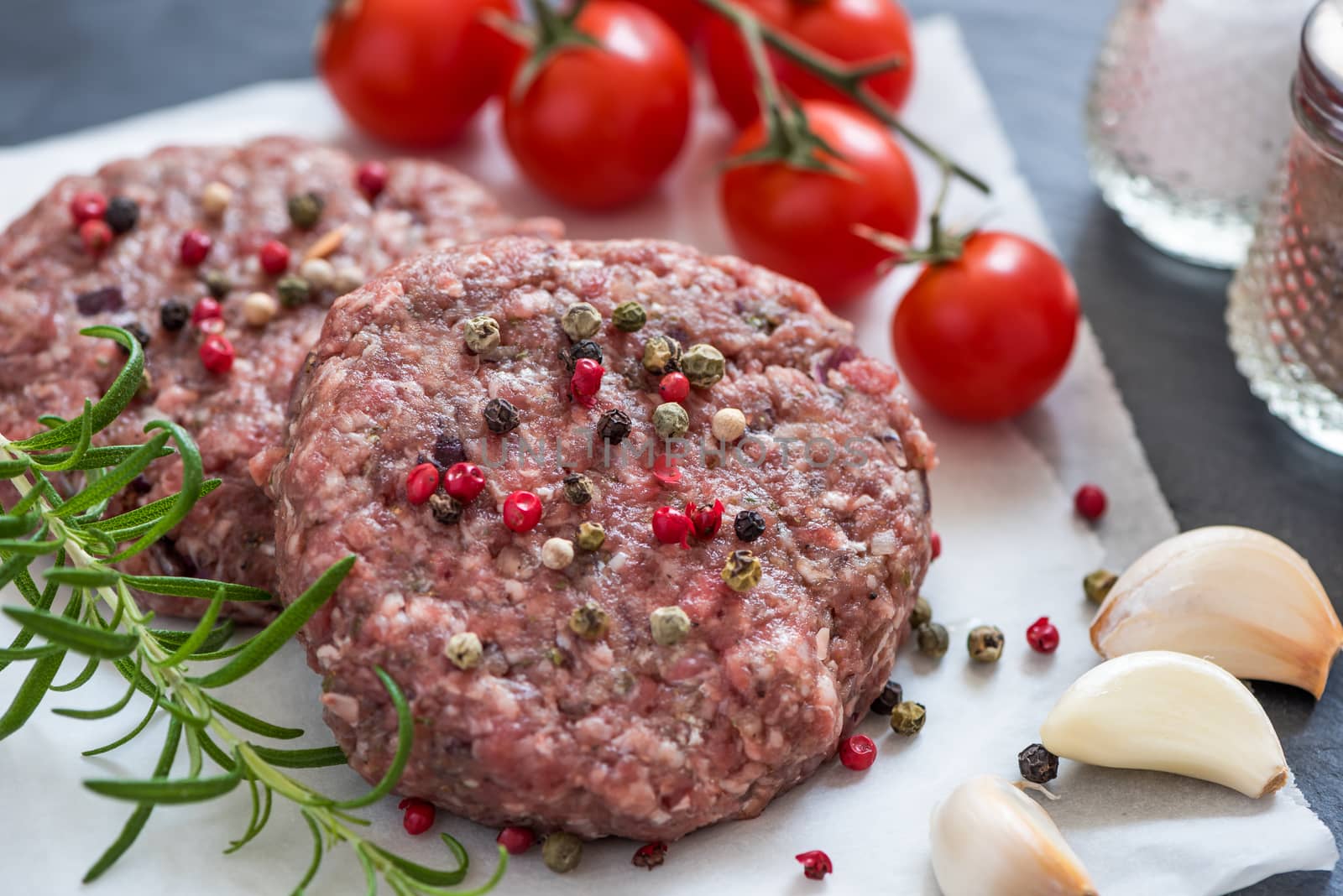 Raw Minced Hamburger Meat with Herb and Spice Prepared for Grilling