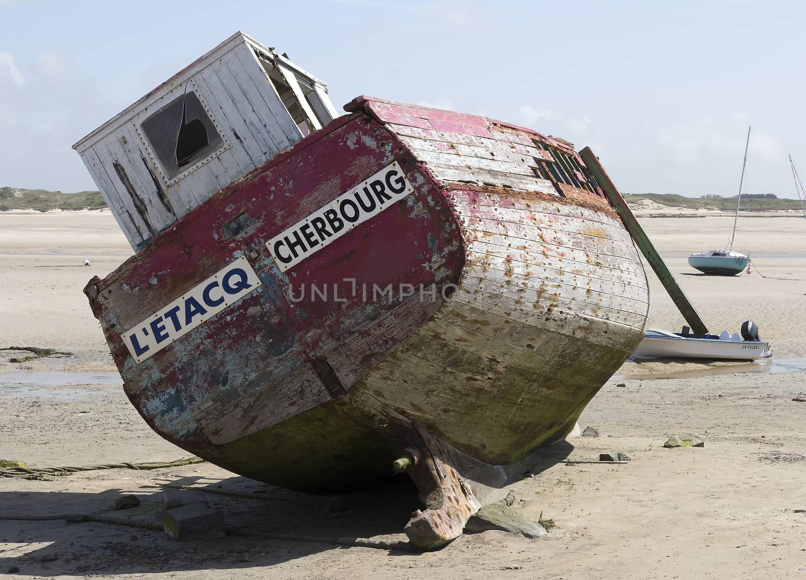 an old vessel on the edge laying on the beach