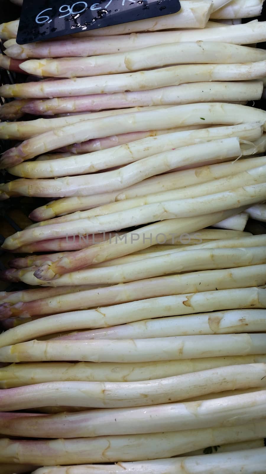 A variety of Fresh White asparagus for sale at a local market. Marché Saint-Antoine Célestins