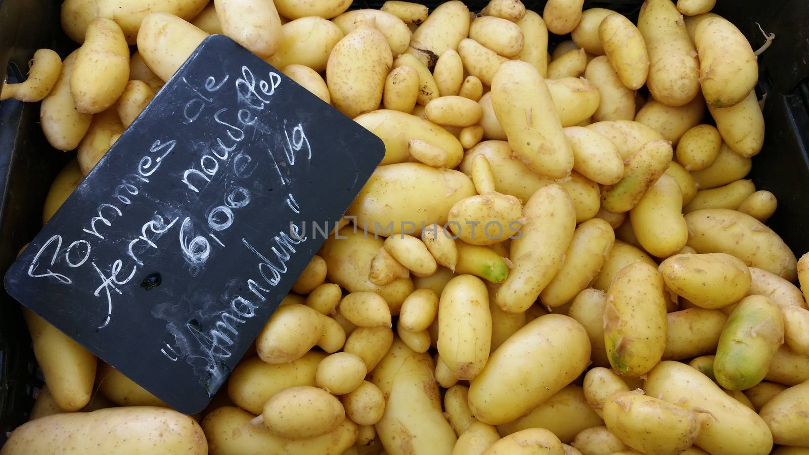 Potatoes for sale in vegetable market of Lyon in France. Marché Saint-Antoine Célestins