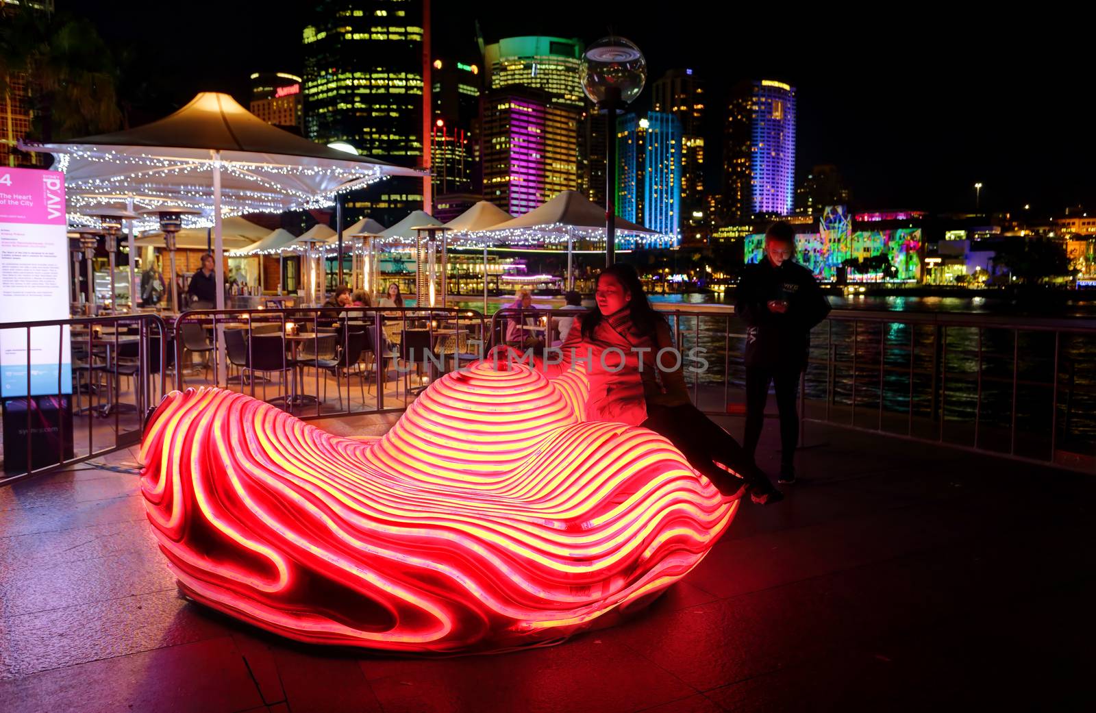 SYDNEY, AUSTRALIA - MAY 27, 2015;   The Heart of the City is designed to be both a public artwork and a catalyst for interaction between people.  A member of the public takes a seat and sensors detect a heart rhythm and the object illuminates with each heart beat
