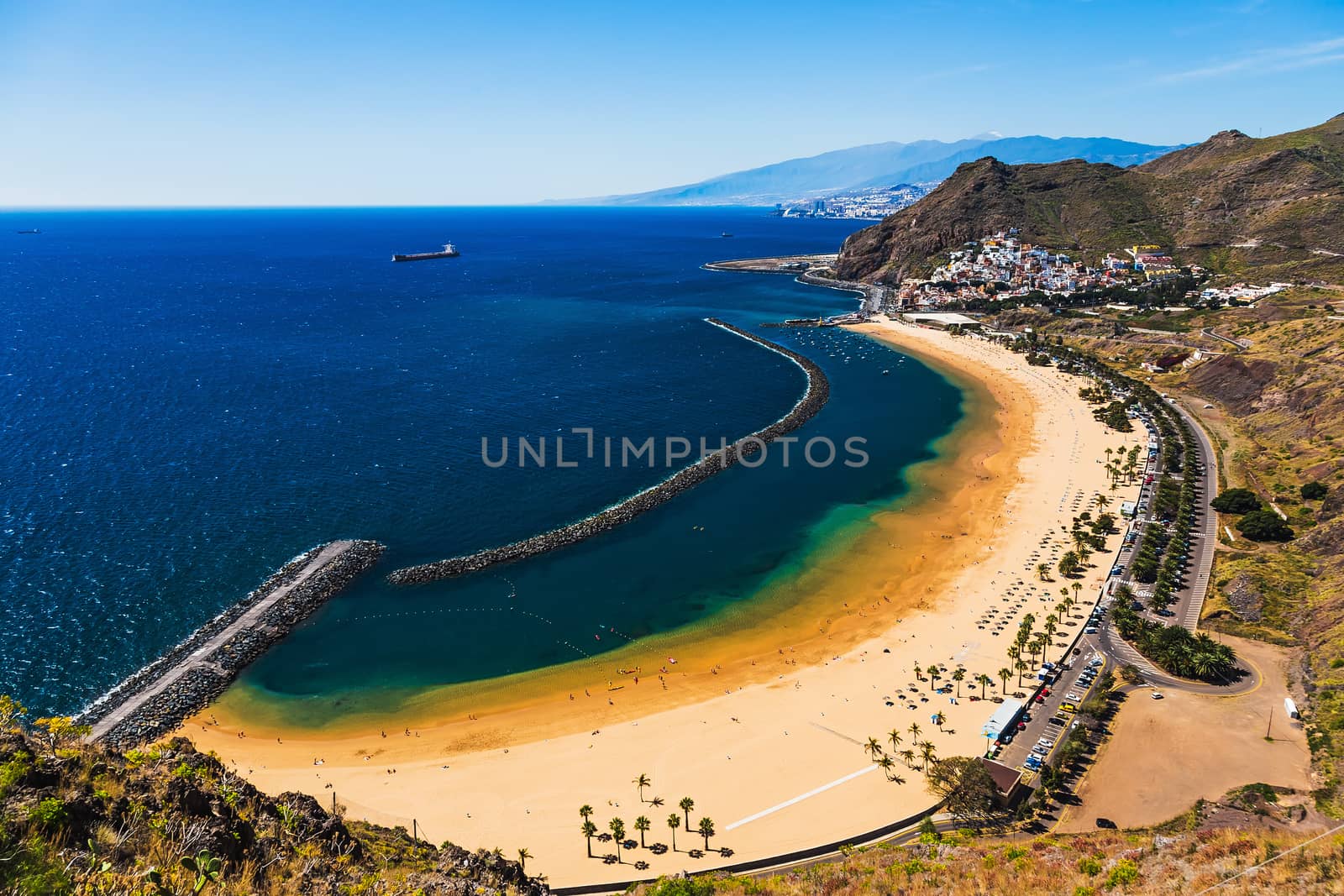 Aerial view to beach or playa Las Teresitas in Santa Cruz on coast of the Atlantic ocean on Tenerife Canary island, Spain at spring or summer