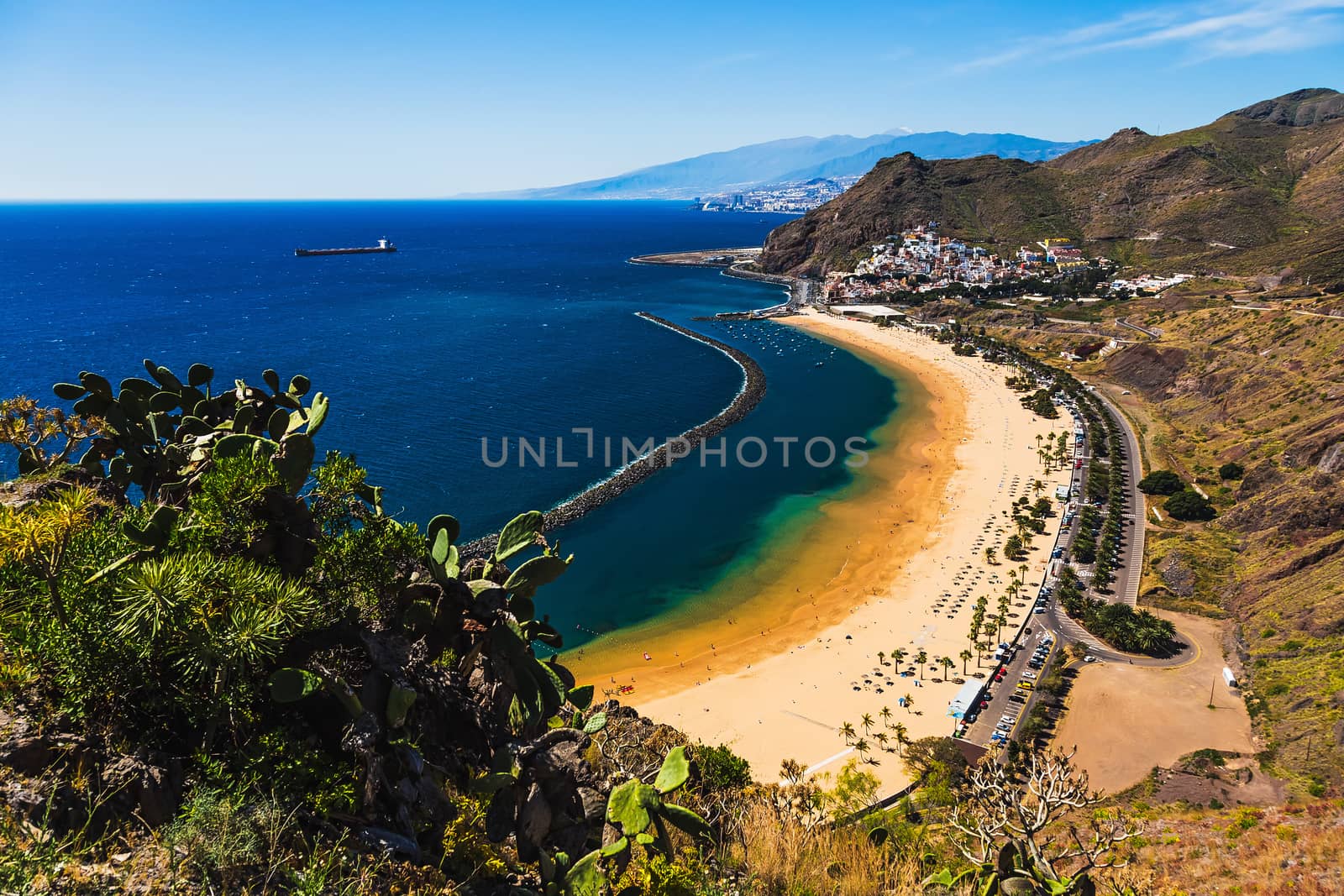Aerial view to beach or playa Las Teresitas in Santa Cruz on shore of the Atlantic ocean on Tenerife Canary island, Spain at spring or summer